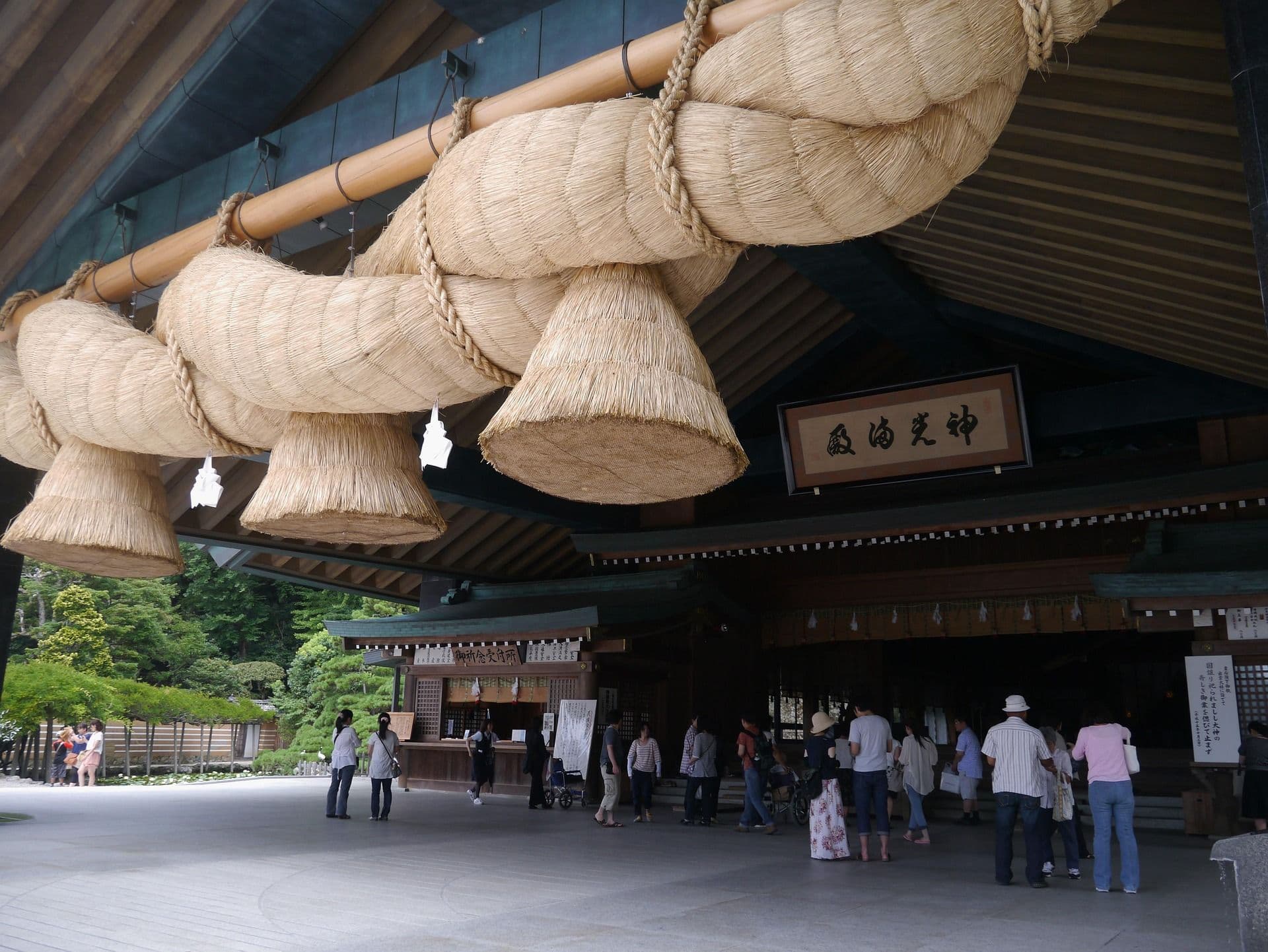 A shrine in Japan with braided straw in Izumo Taisha people standing in line