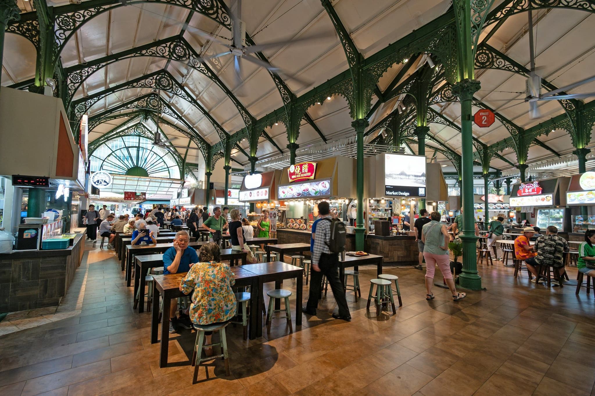 Diners at tables inside the Lau Pa Sat hawker centre