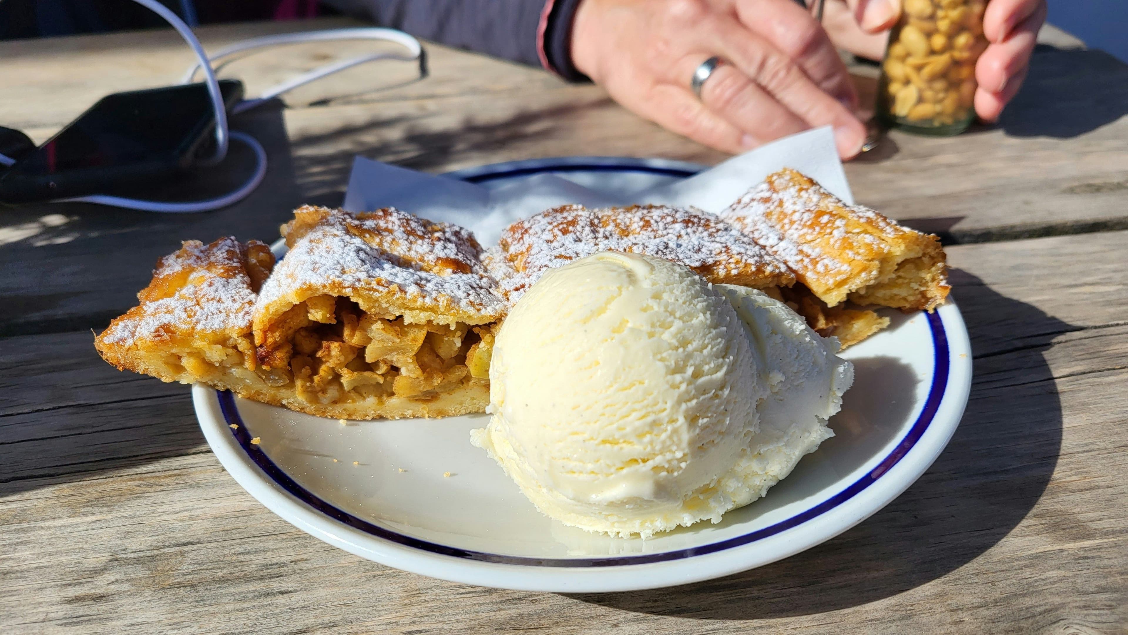 Apfelstrudel on a plate with a vanilla ice scoop