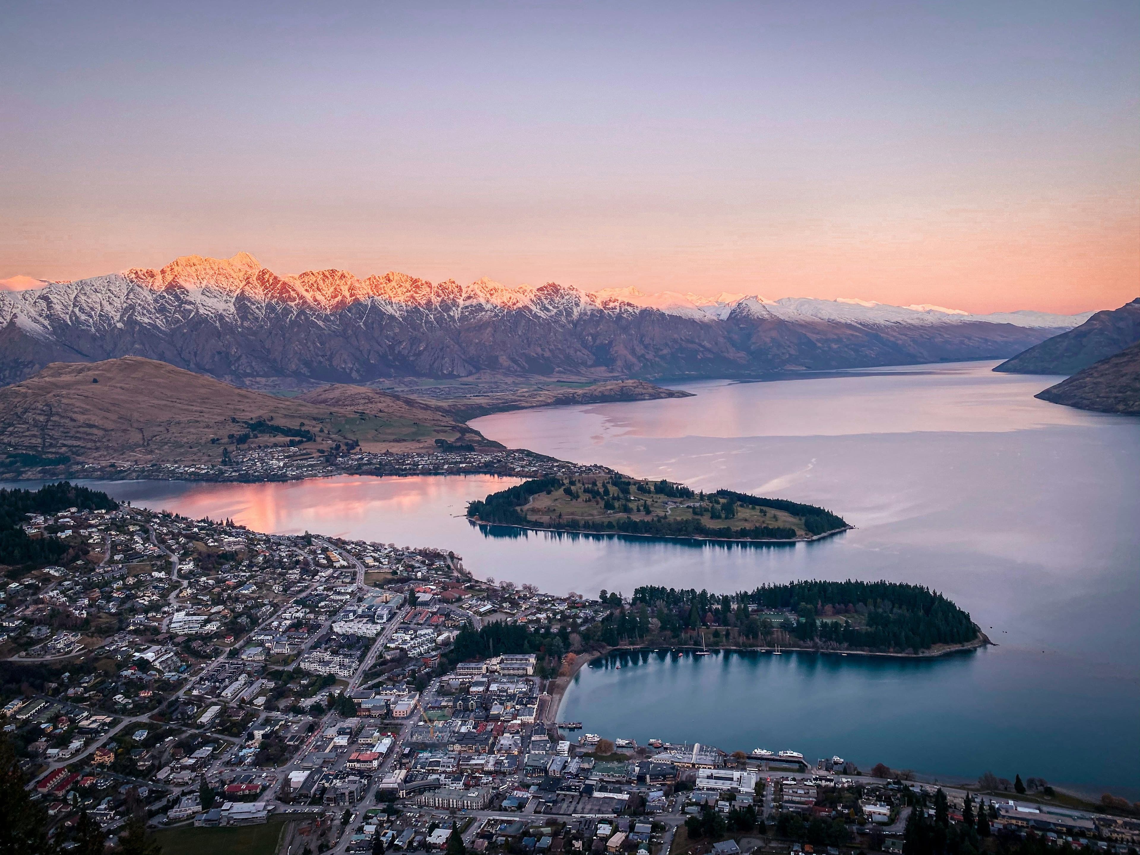 Queenstown: top view of queenstown in new zealand, the bay with water and city visible