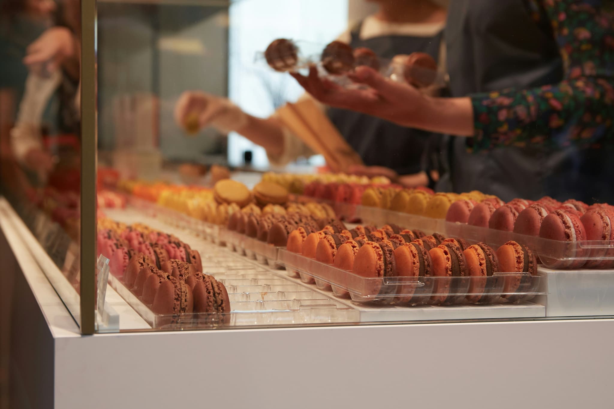 macarons displayed in a Paris patisserie window