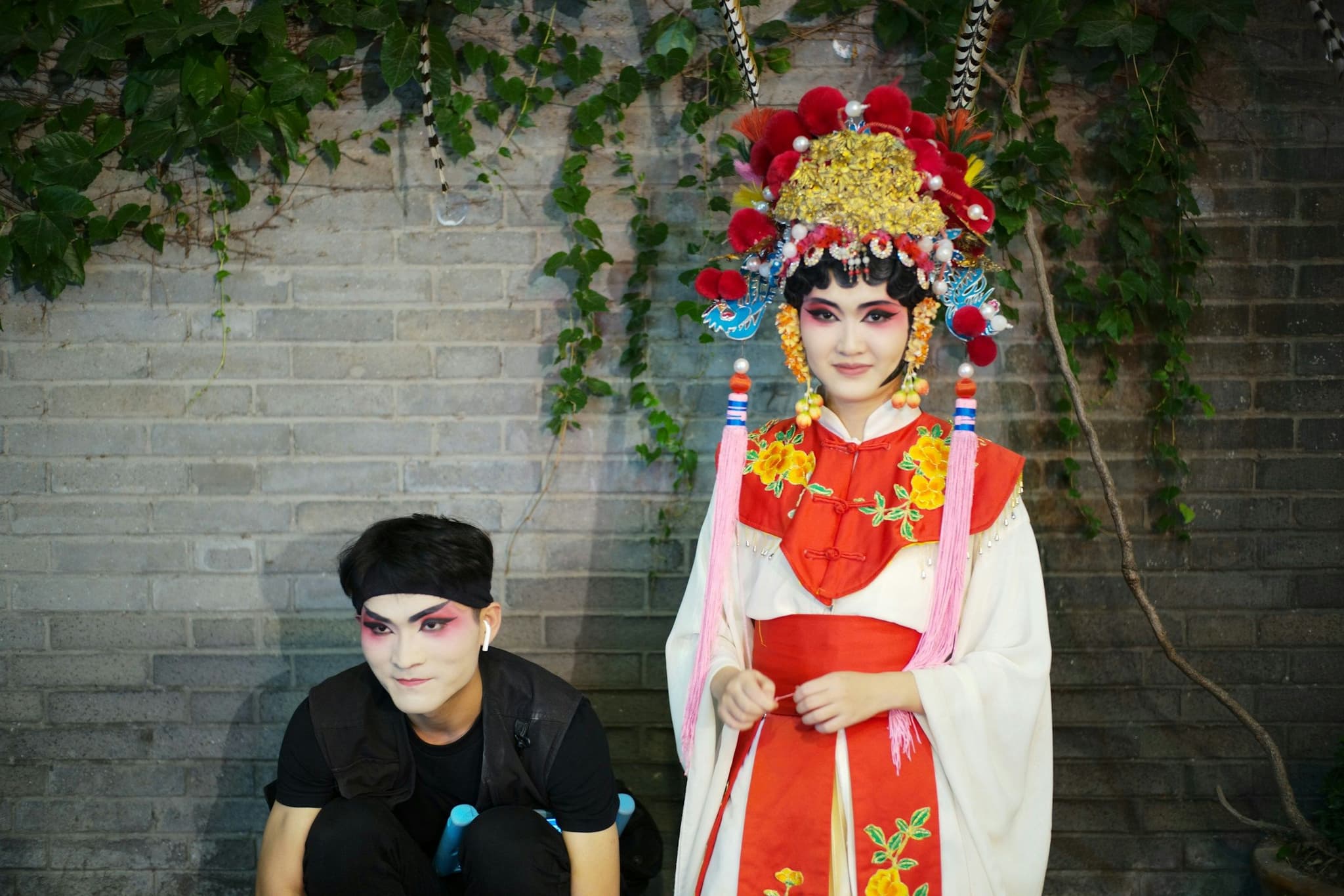 Two performers in traditional opera costumes in Kuanzhai Alley, Chengdu