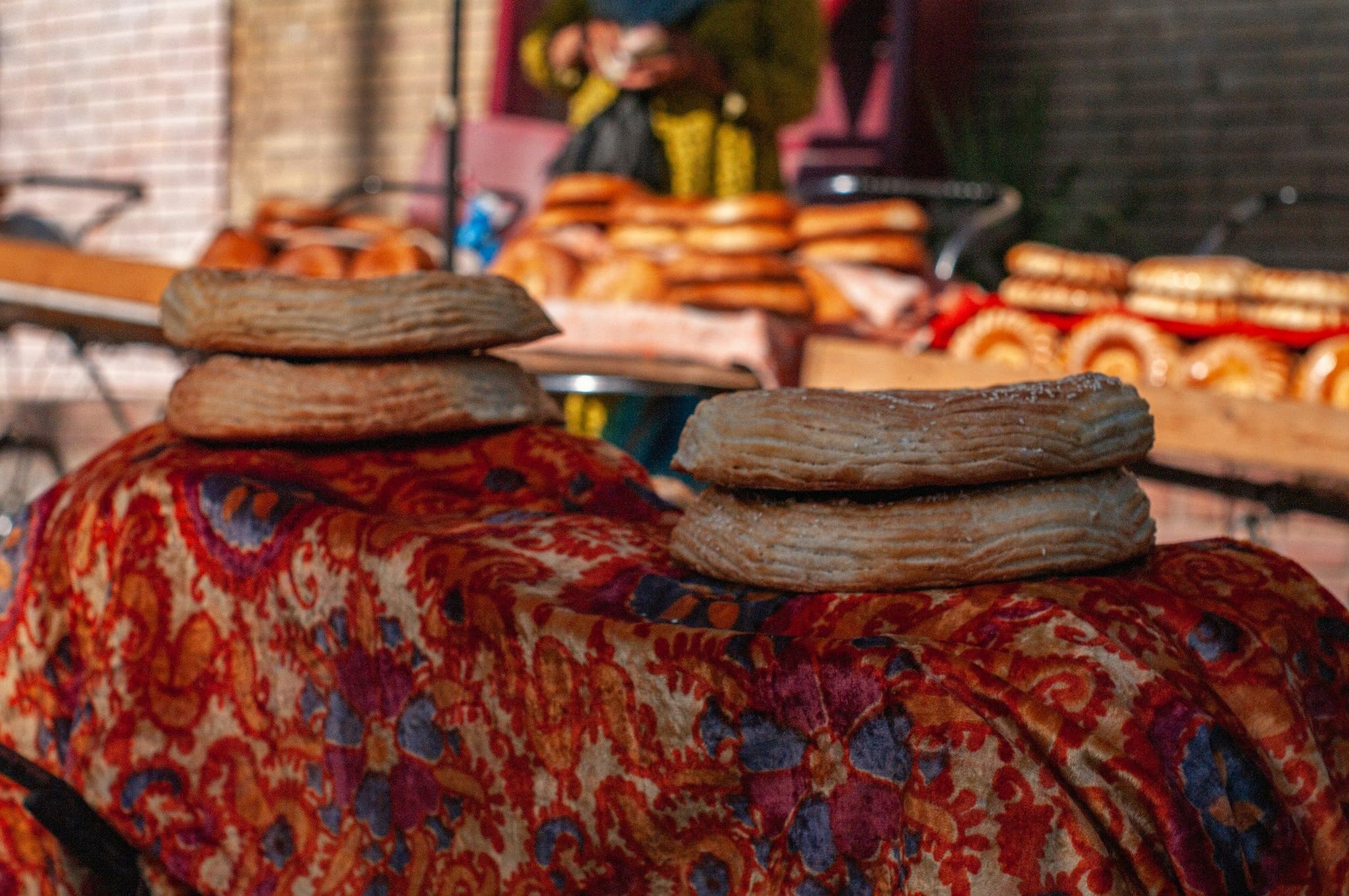 Round loaves of bread on display at a market stall