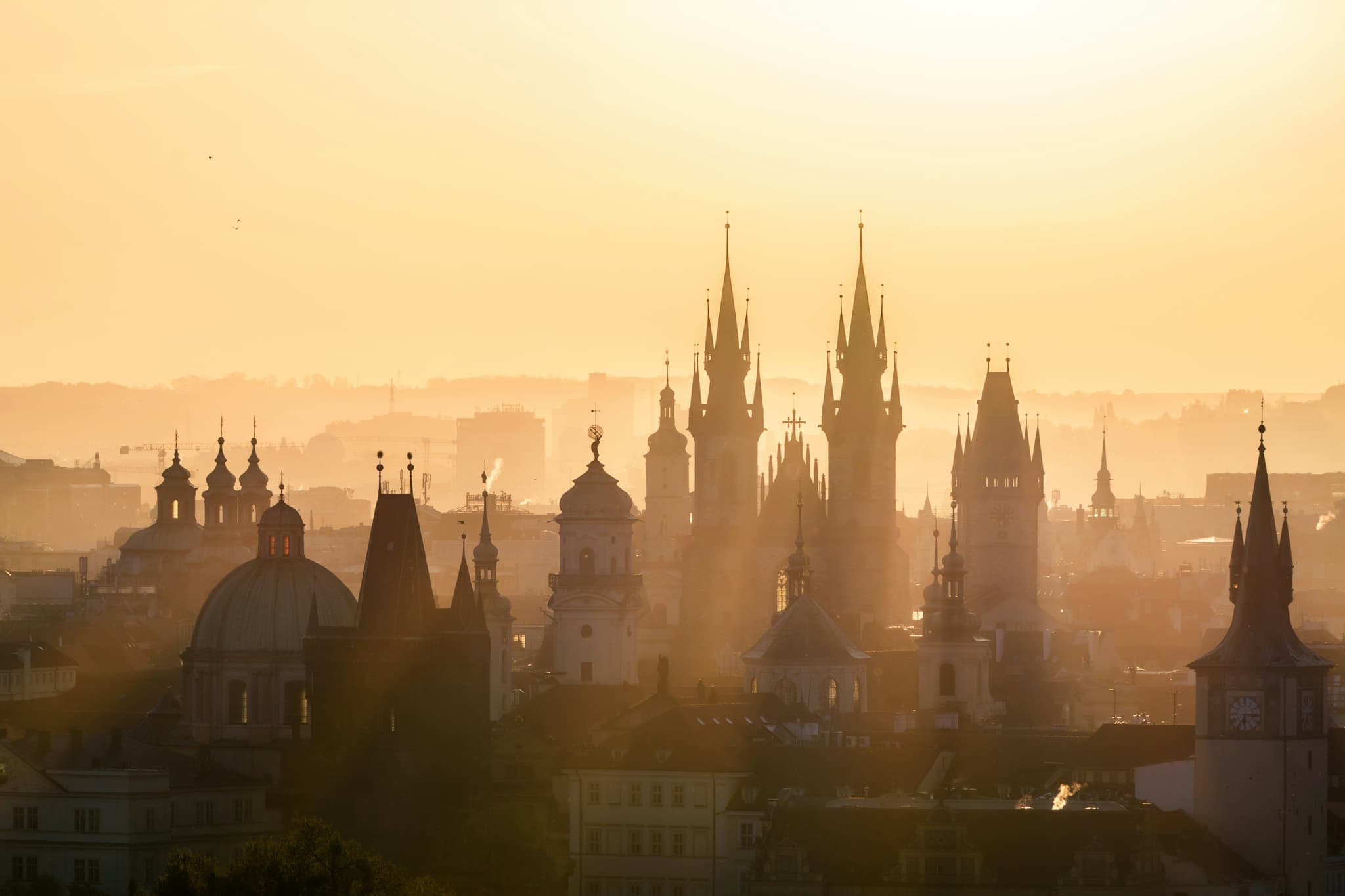 Sunset view of gothic churches in prague