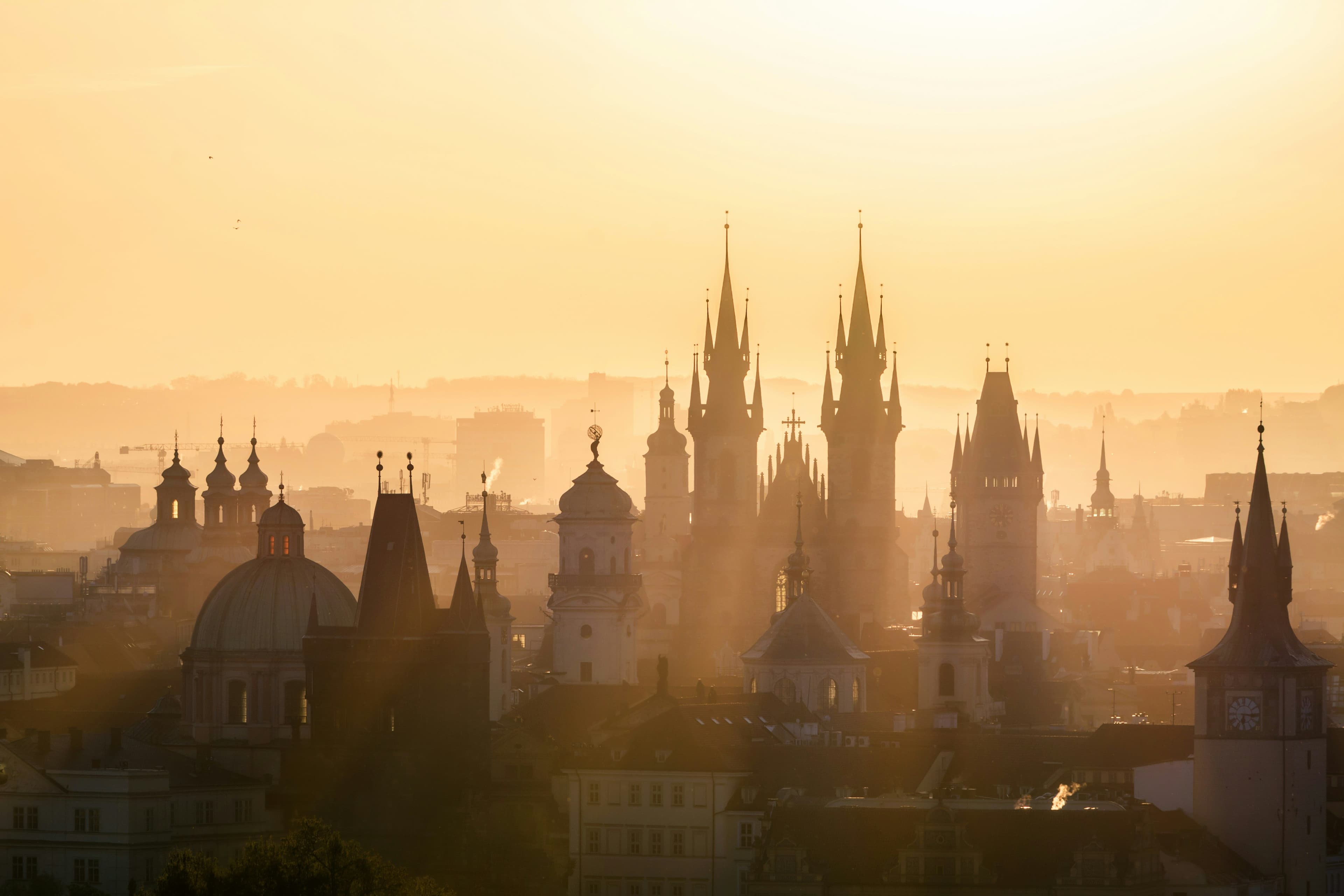 Sunset view of gothic churches in prague