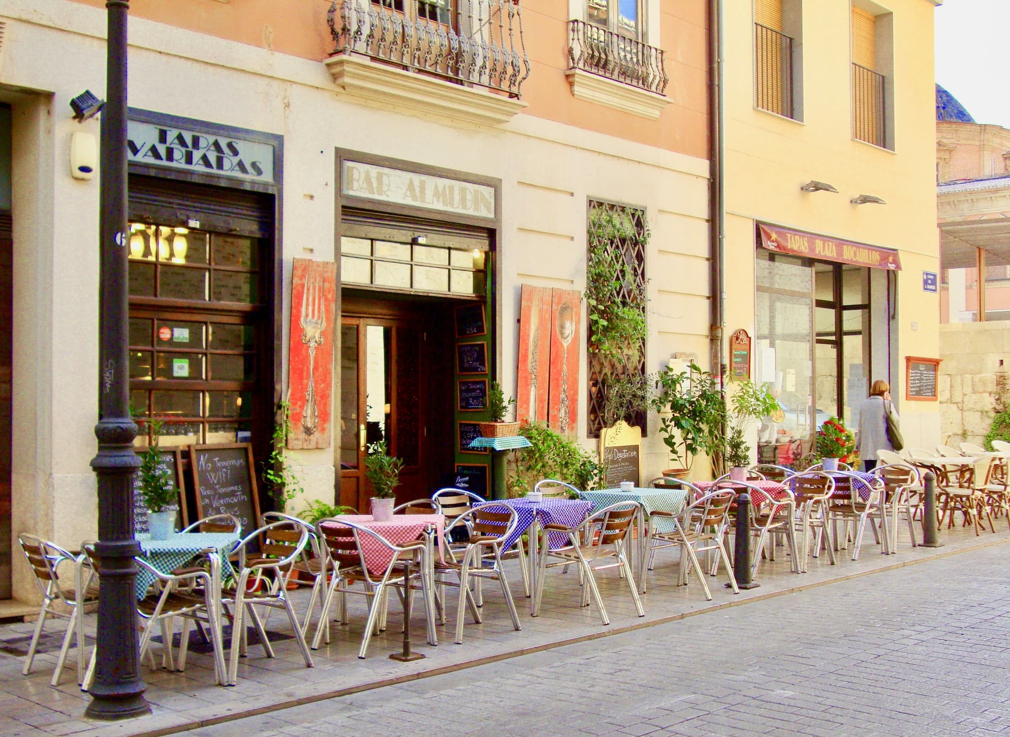 tapas shop with colorful chairs outside