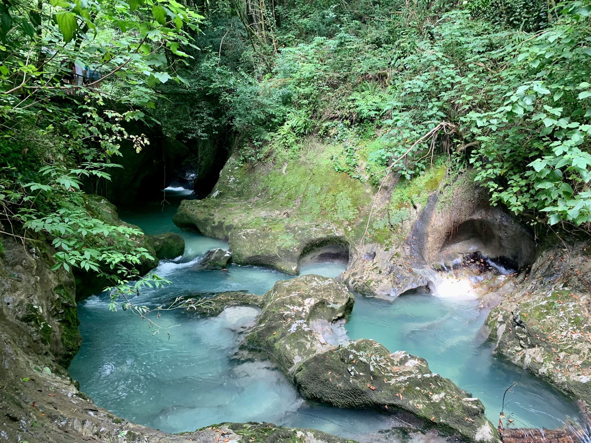 Cliffs and turqoise cool water natural pools with greenery
