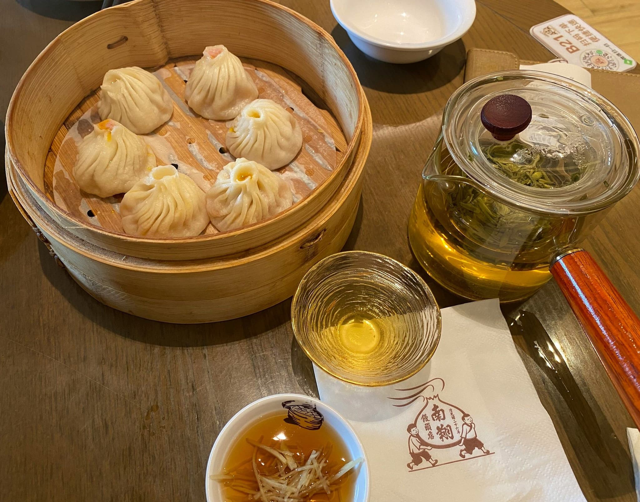 Xiaolongbao soup dumplings in a steamer basket at Nanxiang, Shanghai
