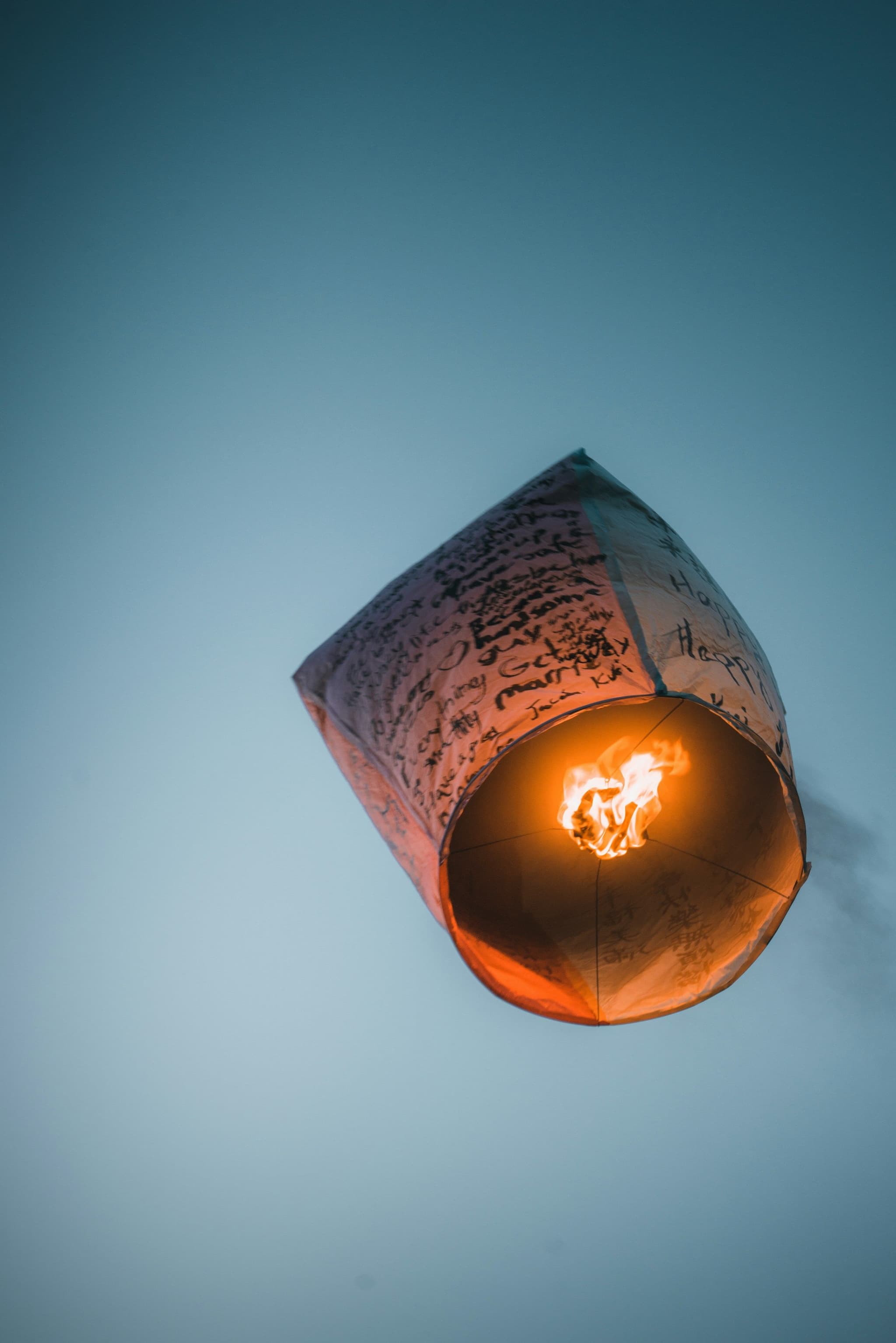 A sky lantern rising into the evening sky at Shifen