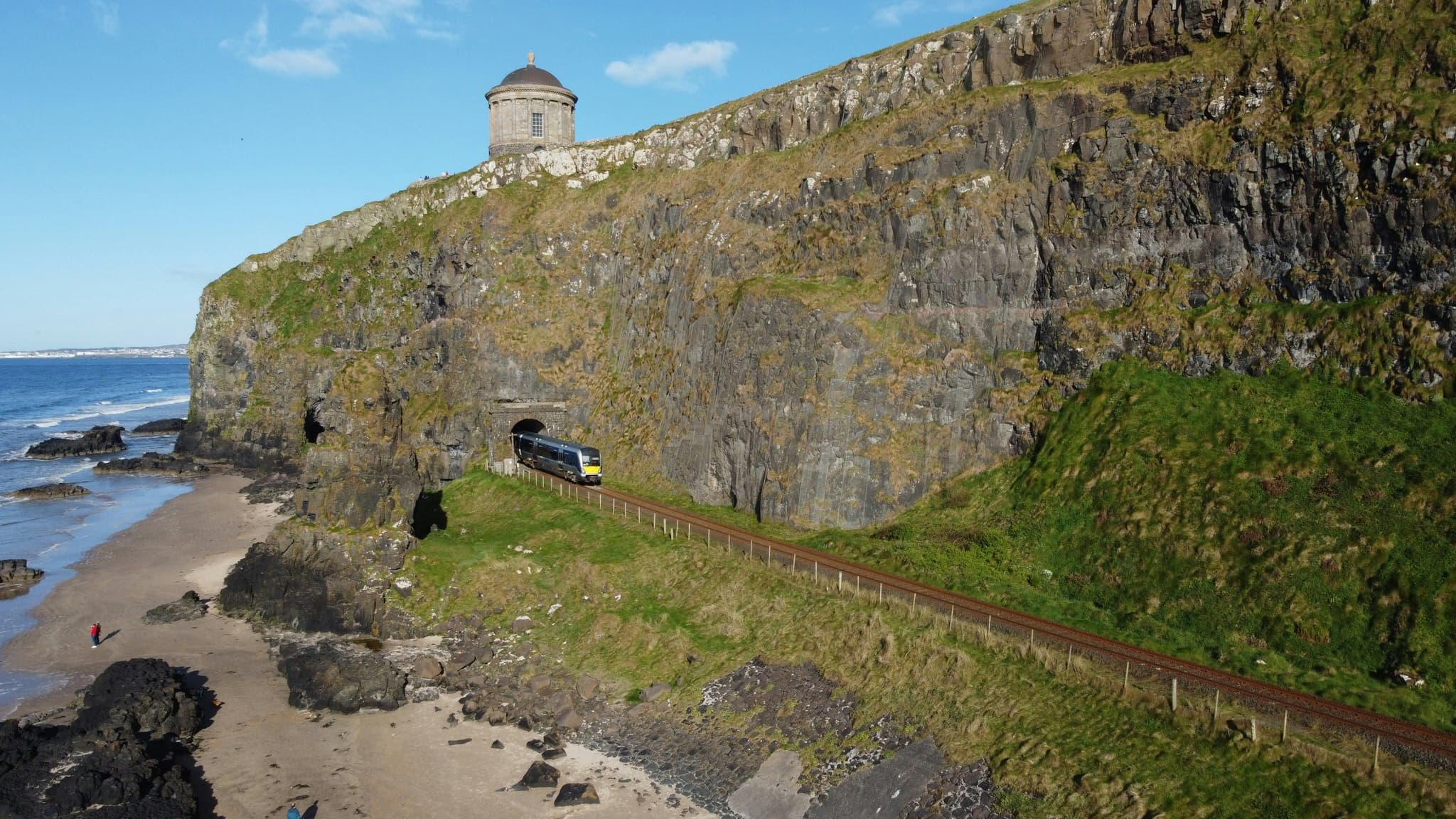 A small tower and stone wall at Downhill Strand