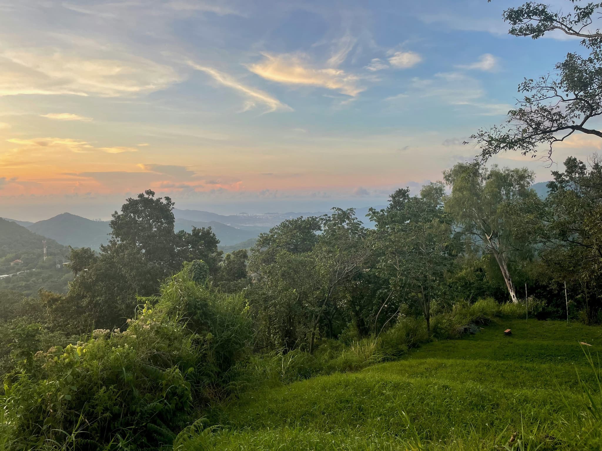 Landscape with green hills and sunset