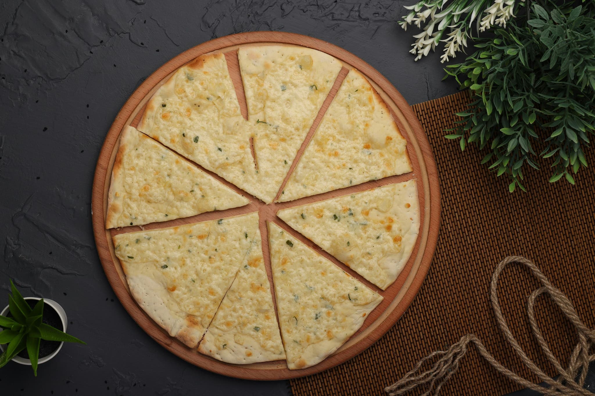 Socca round chickpea flatbread cut into pizza slices