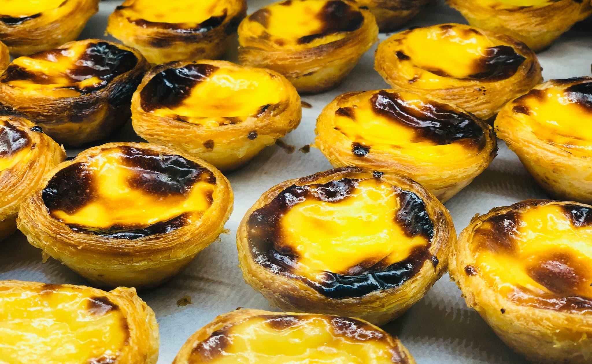 Tiny pastéis de nata slightly burned