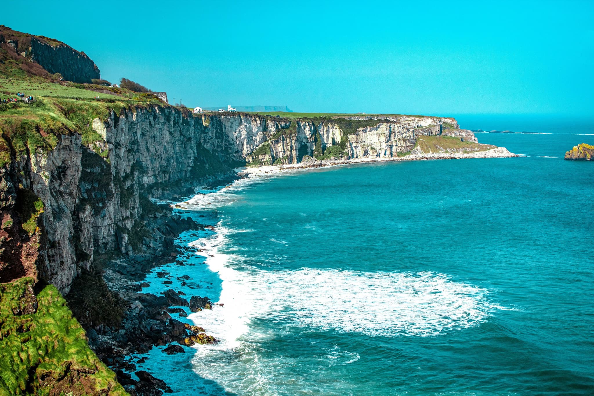 Turqoise sea and cliff in Northern Ireland