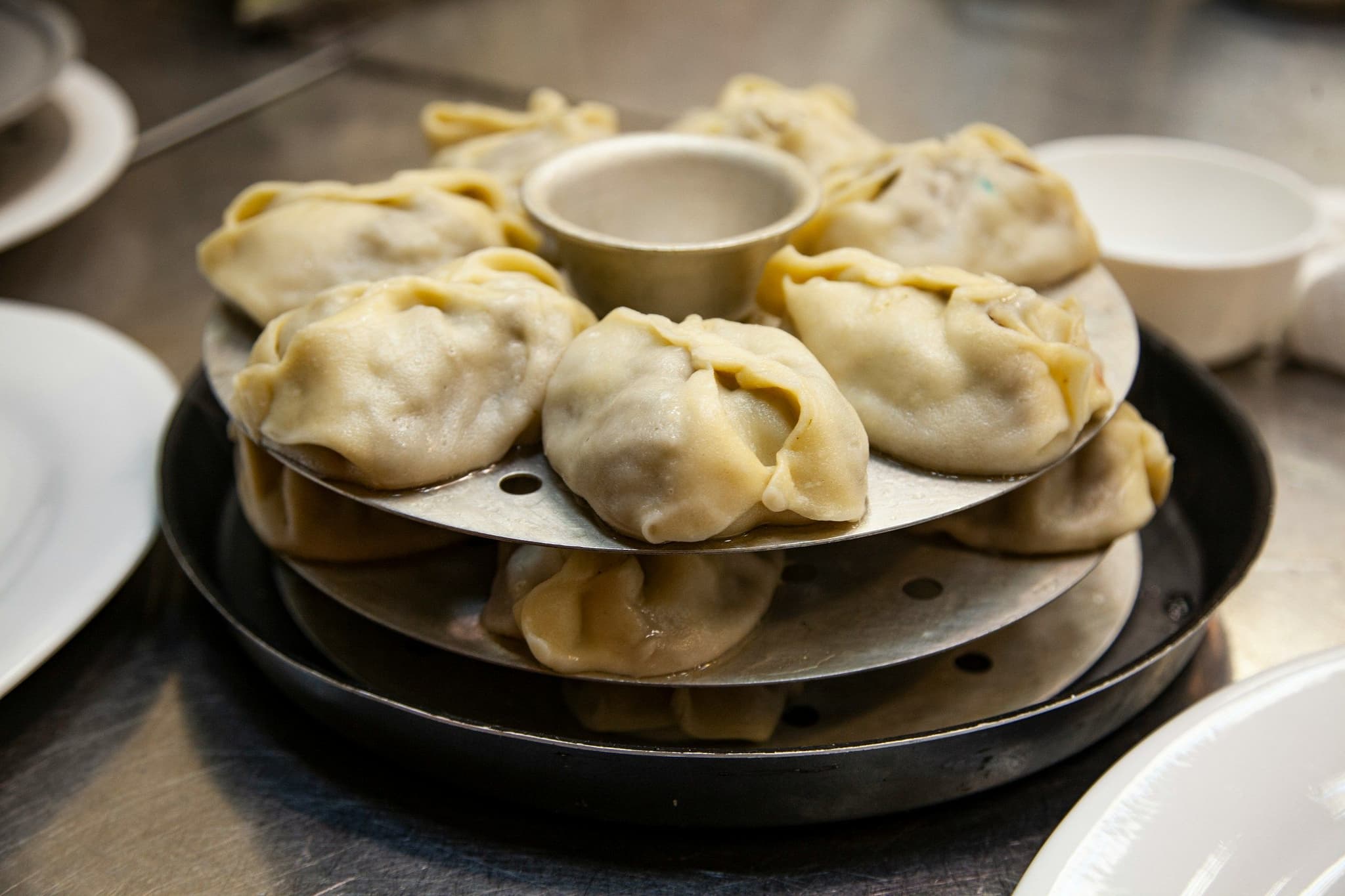 A plate of steamed manty dumplings