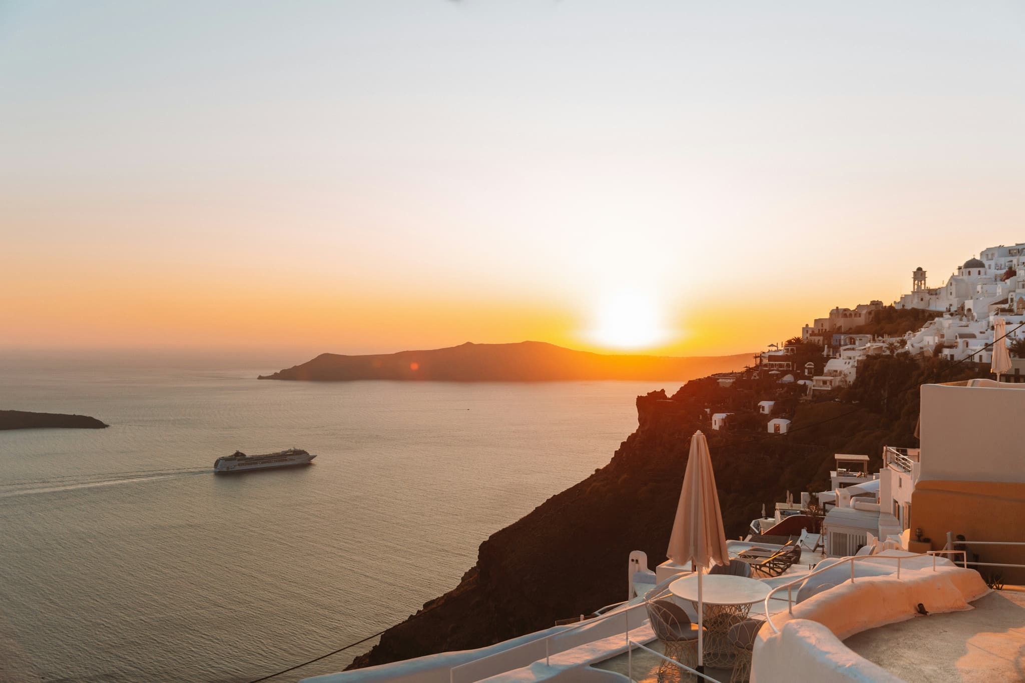 Sea water and mountain during Sunset in Oia