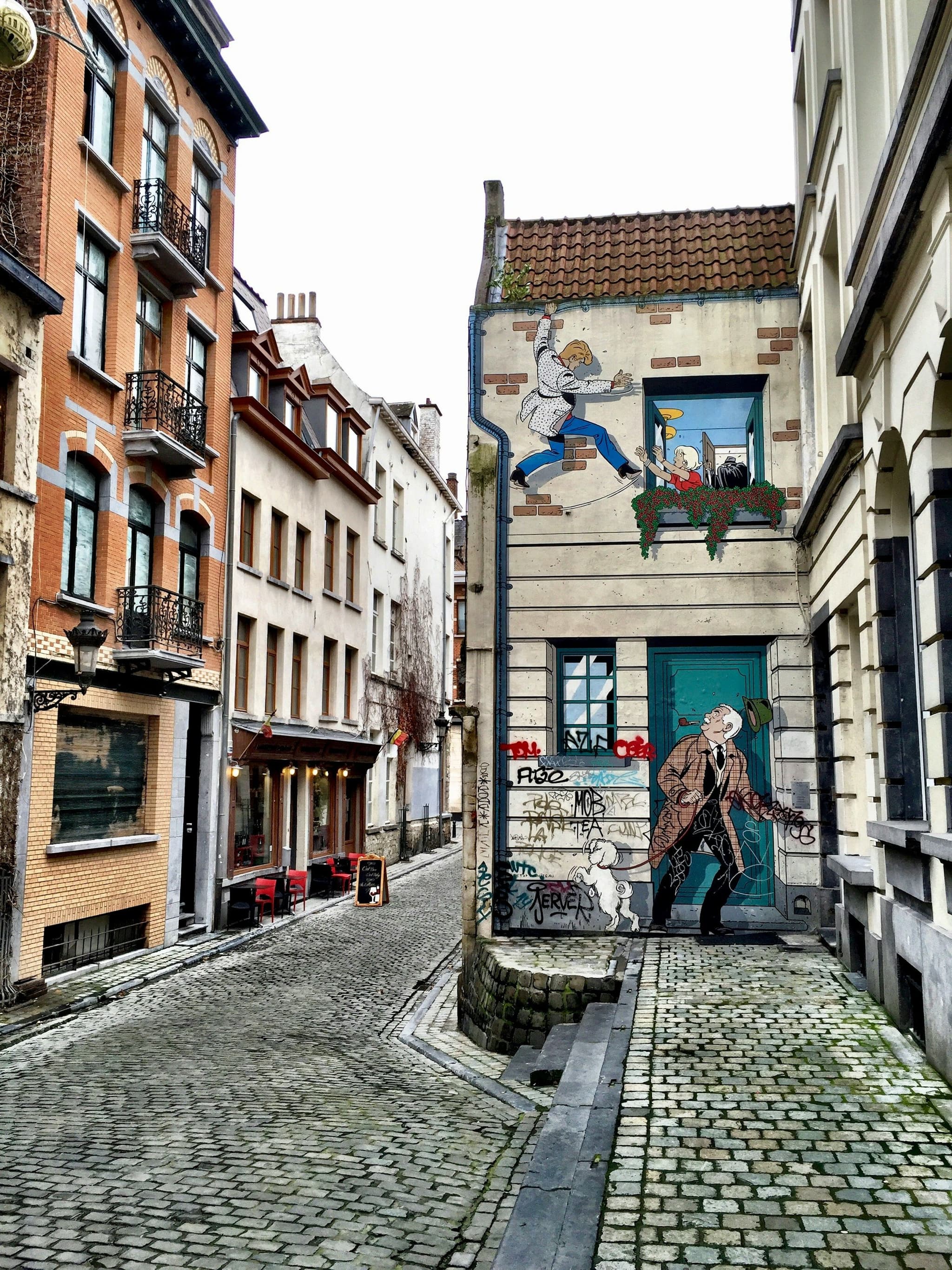 A comic-strip mural painted on a building facade in Brussels