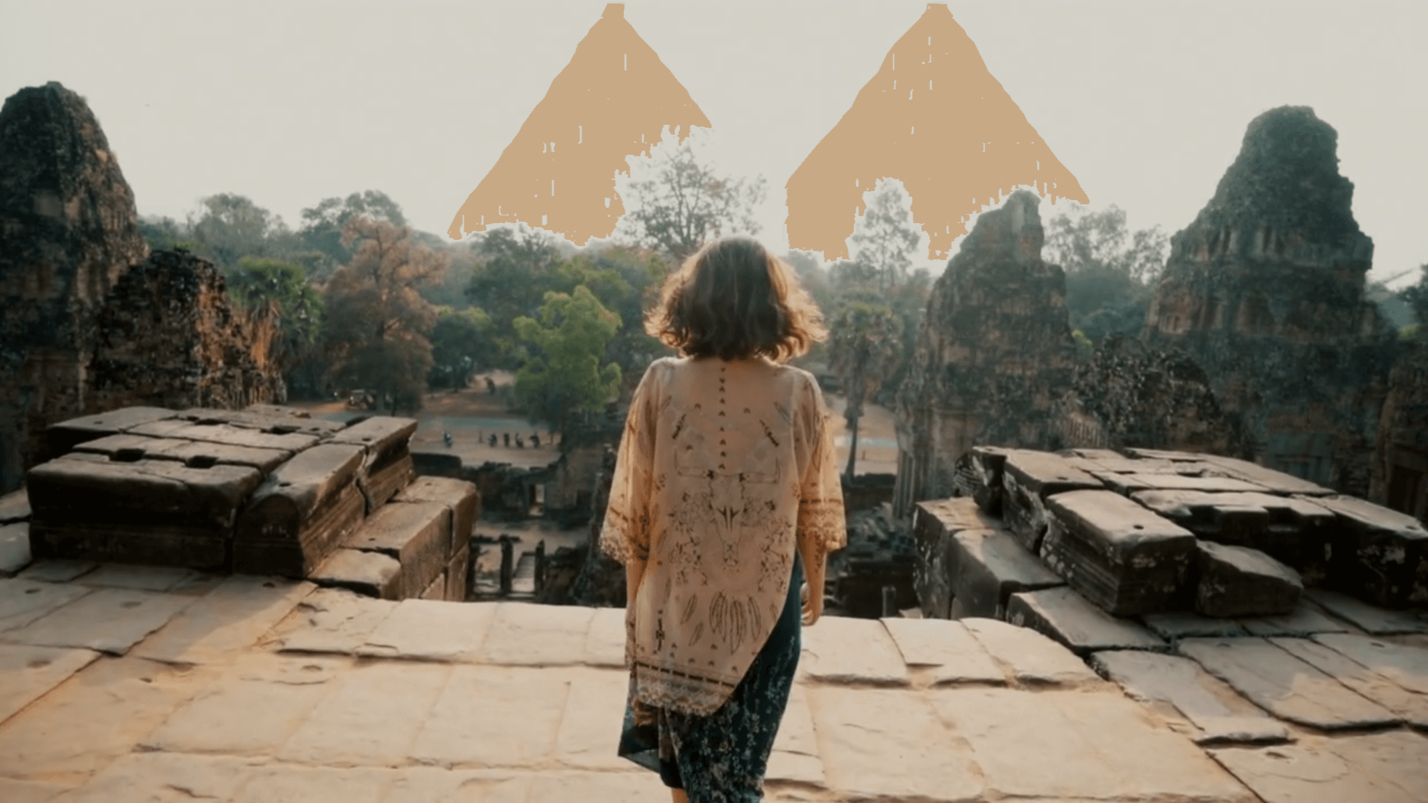 girl standing in front of ancient monuments