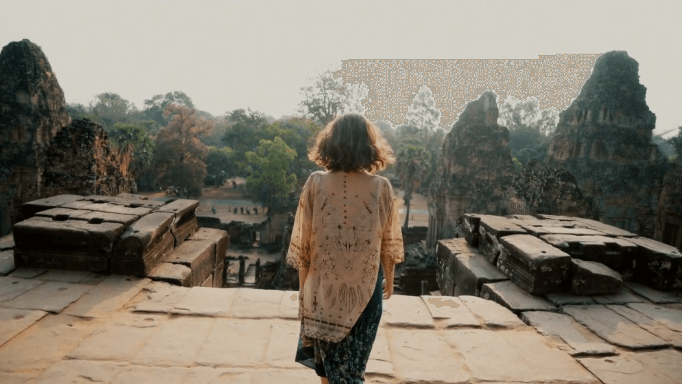 girl standing in front of ancient monuments