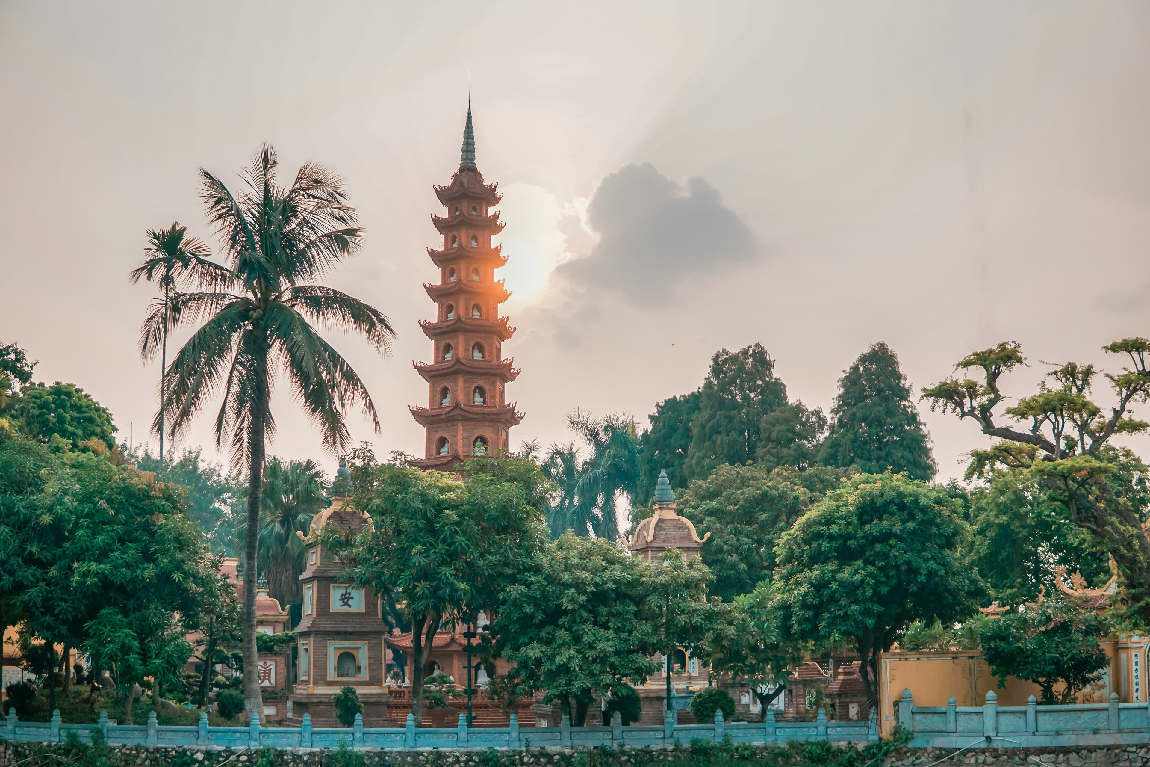 Hanoi city temples and palm trees on a cloudy day