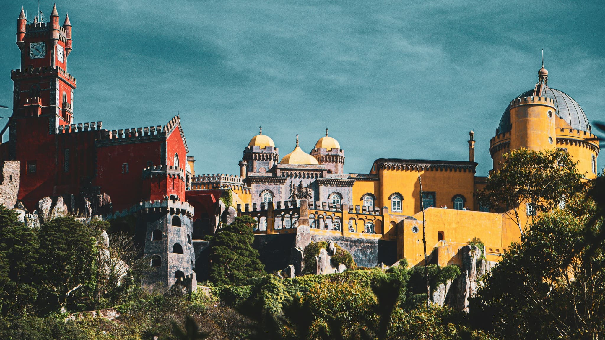Colourful castle buildings on a hill in Sintra