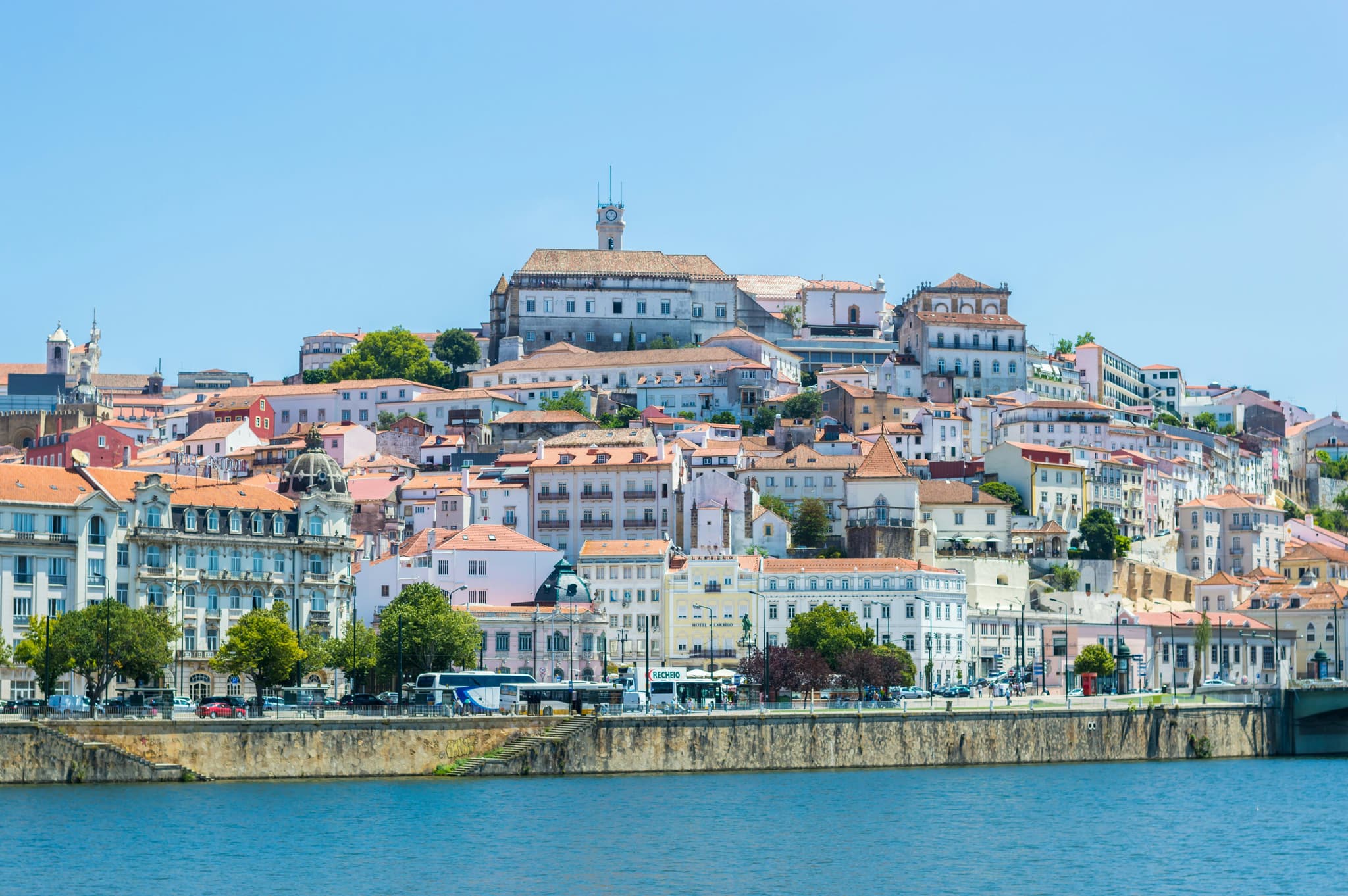The city skyline of Coimbra along the river