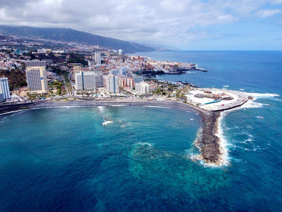 Aerial drone view of the coastline and town in Tenerife, Canary Islands.