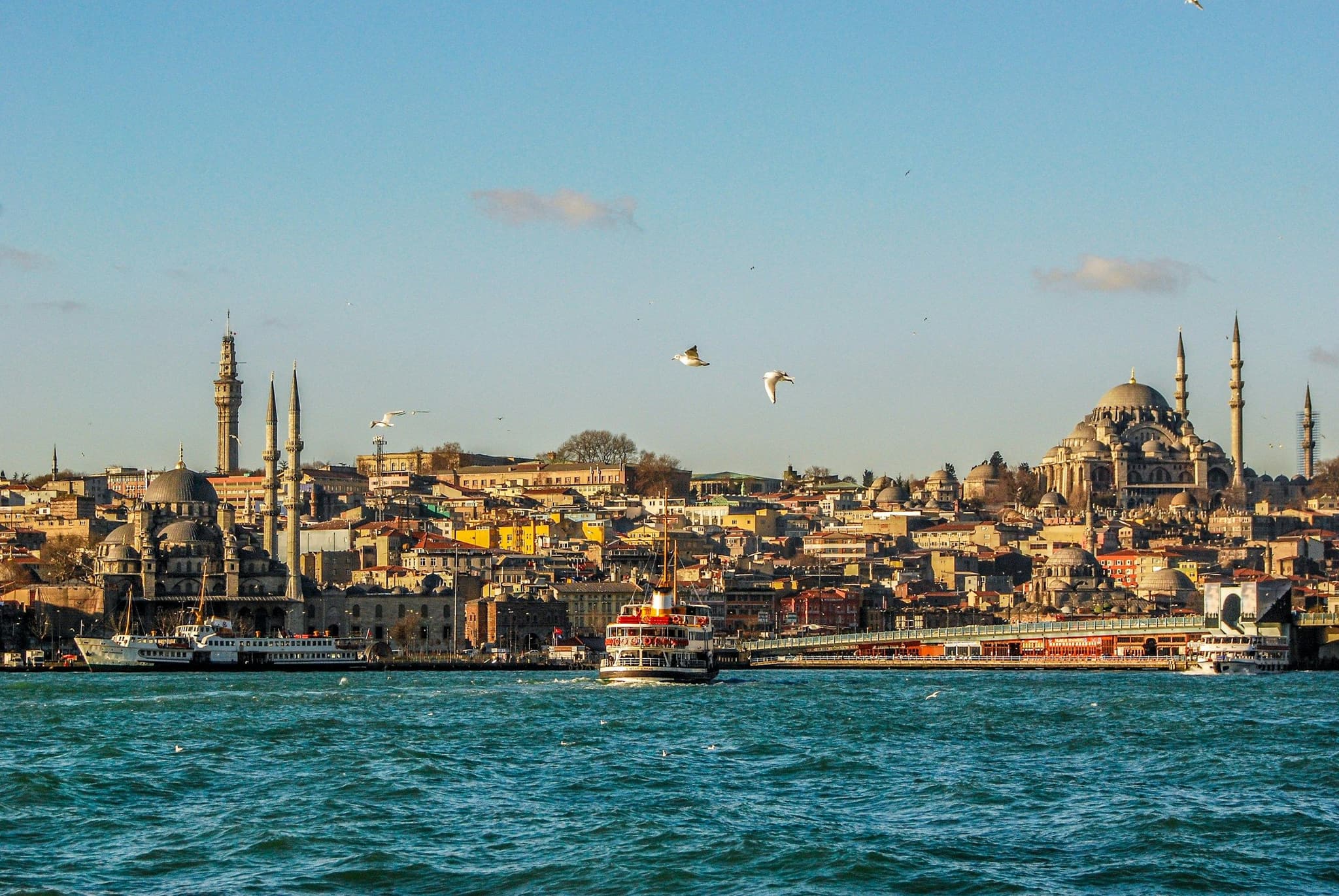 A ferry crossing the Bosphorus with the Eminönü skyline behind