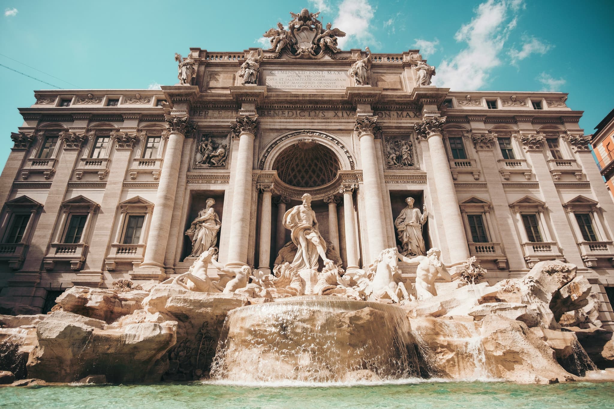 Roman building with white statues in Rome