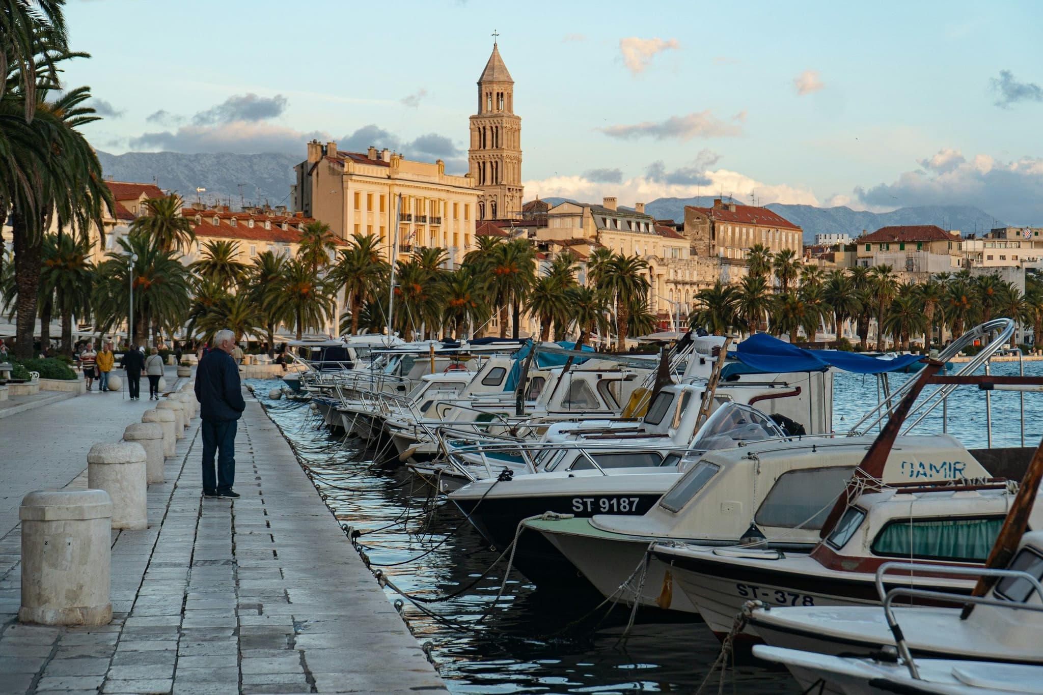 Boats moored along the Split waterfront below the old town