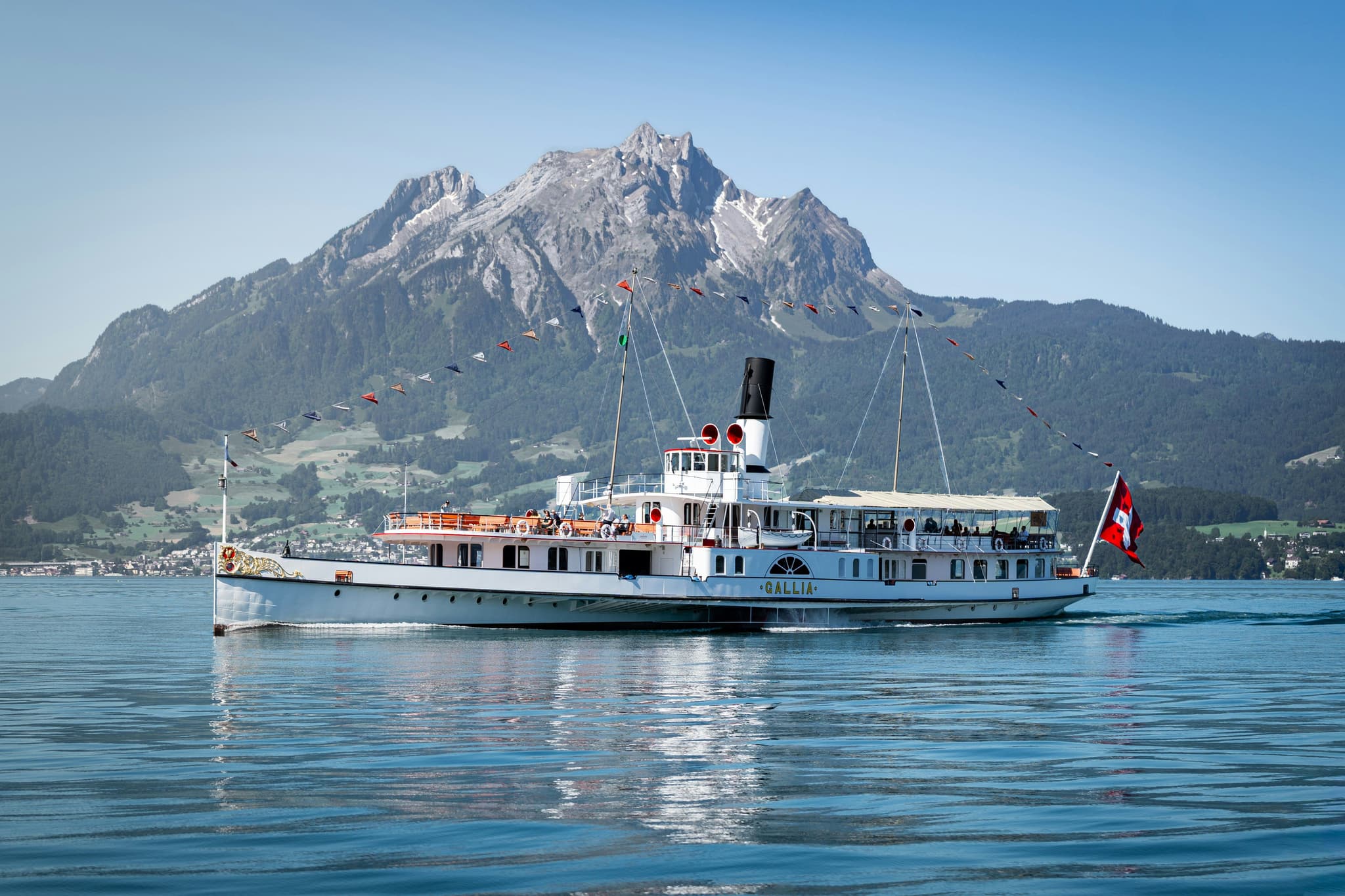 paddle steamer crossing Lake Lucerne with mountains behind