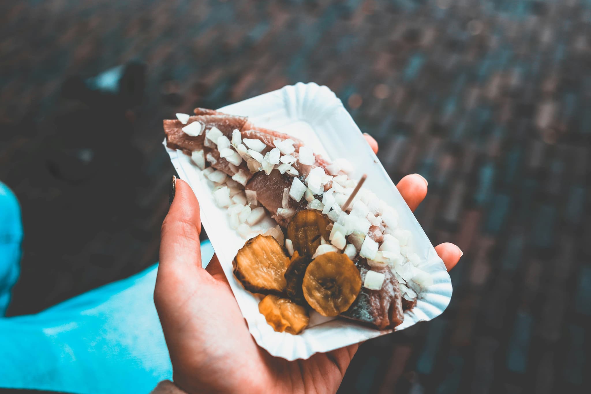 herring from a market stall with onions