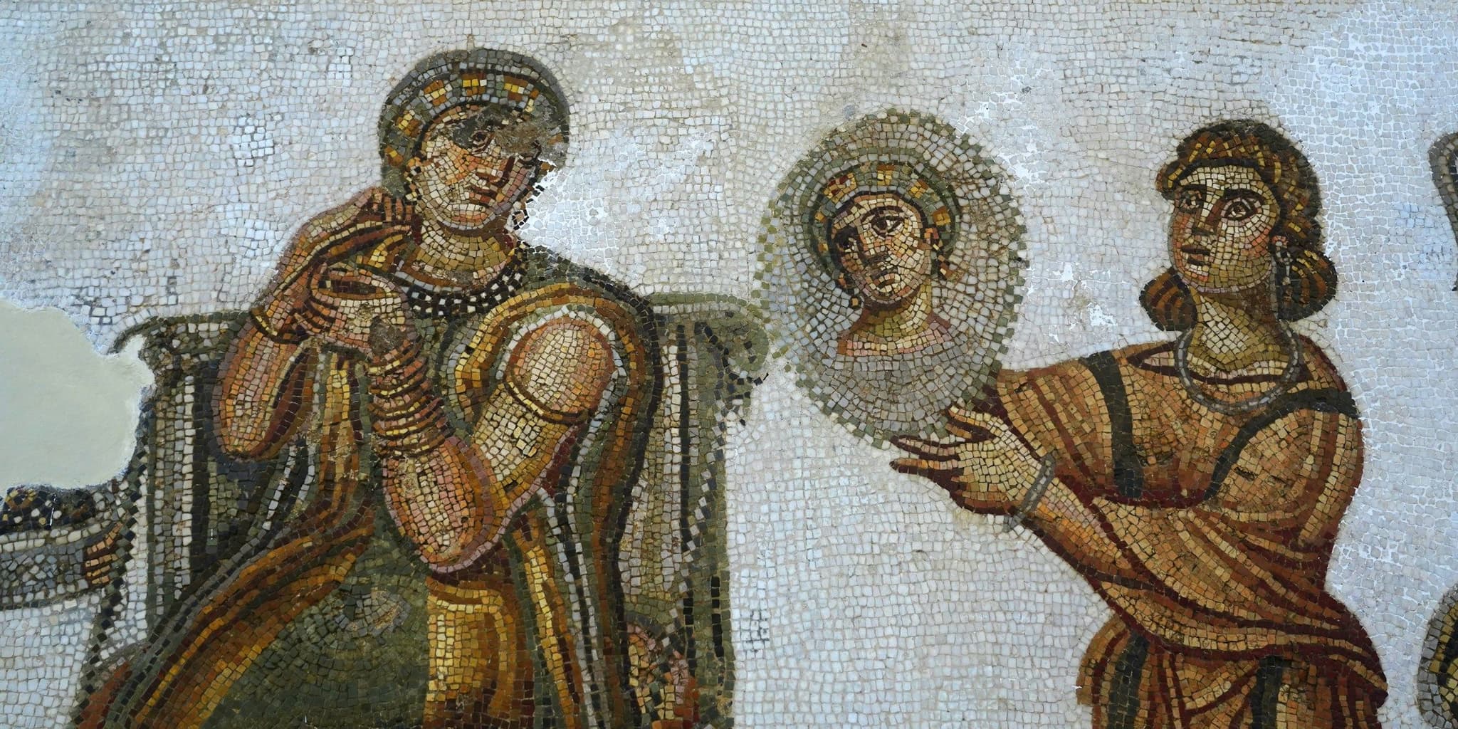 A Roman floor mosaic showing human figures