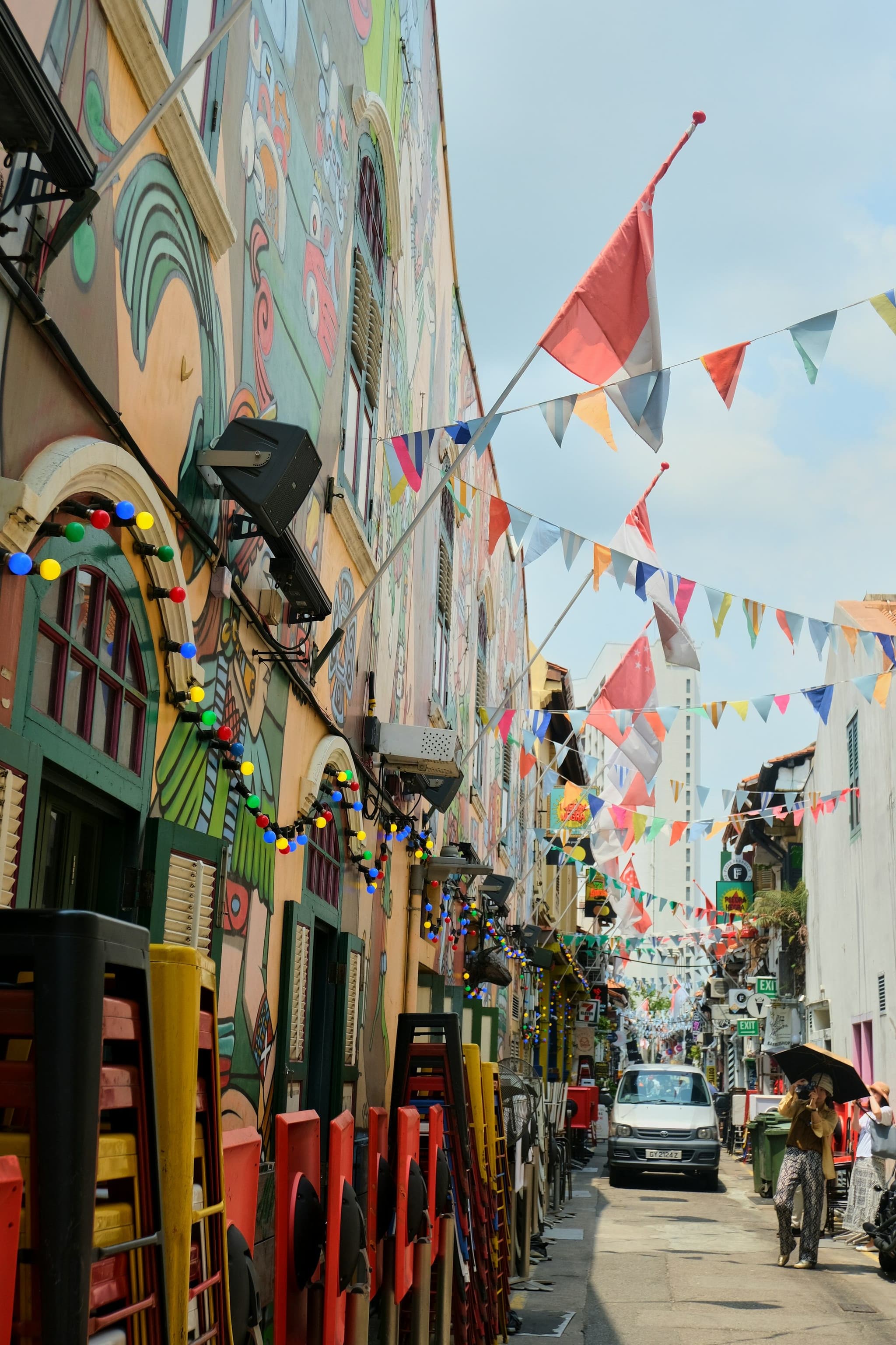 Colourful shophouses, street lights and bunting on a street in Kampong Glam