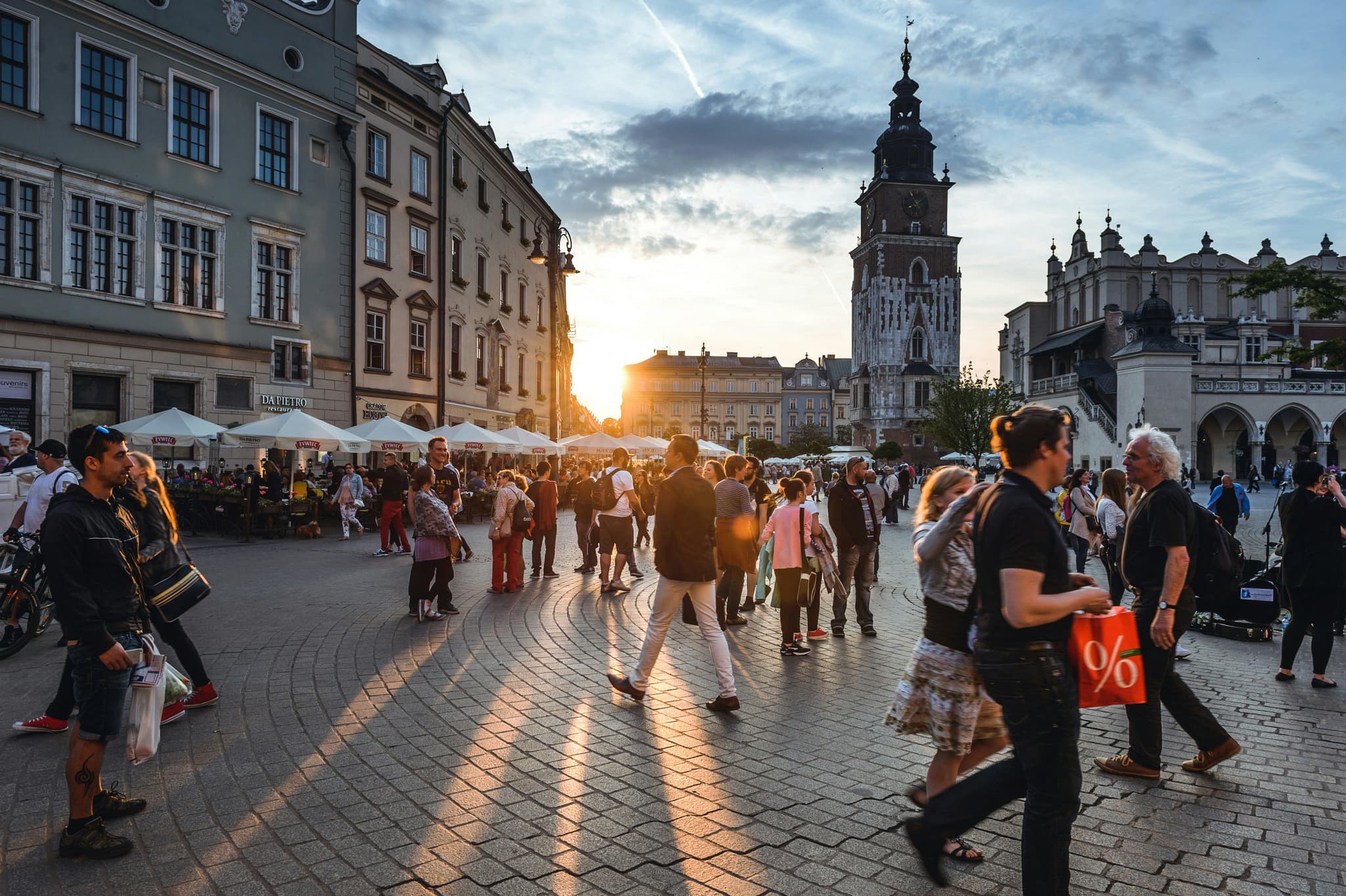 Kraków city square with peoeple walking around