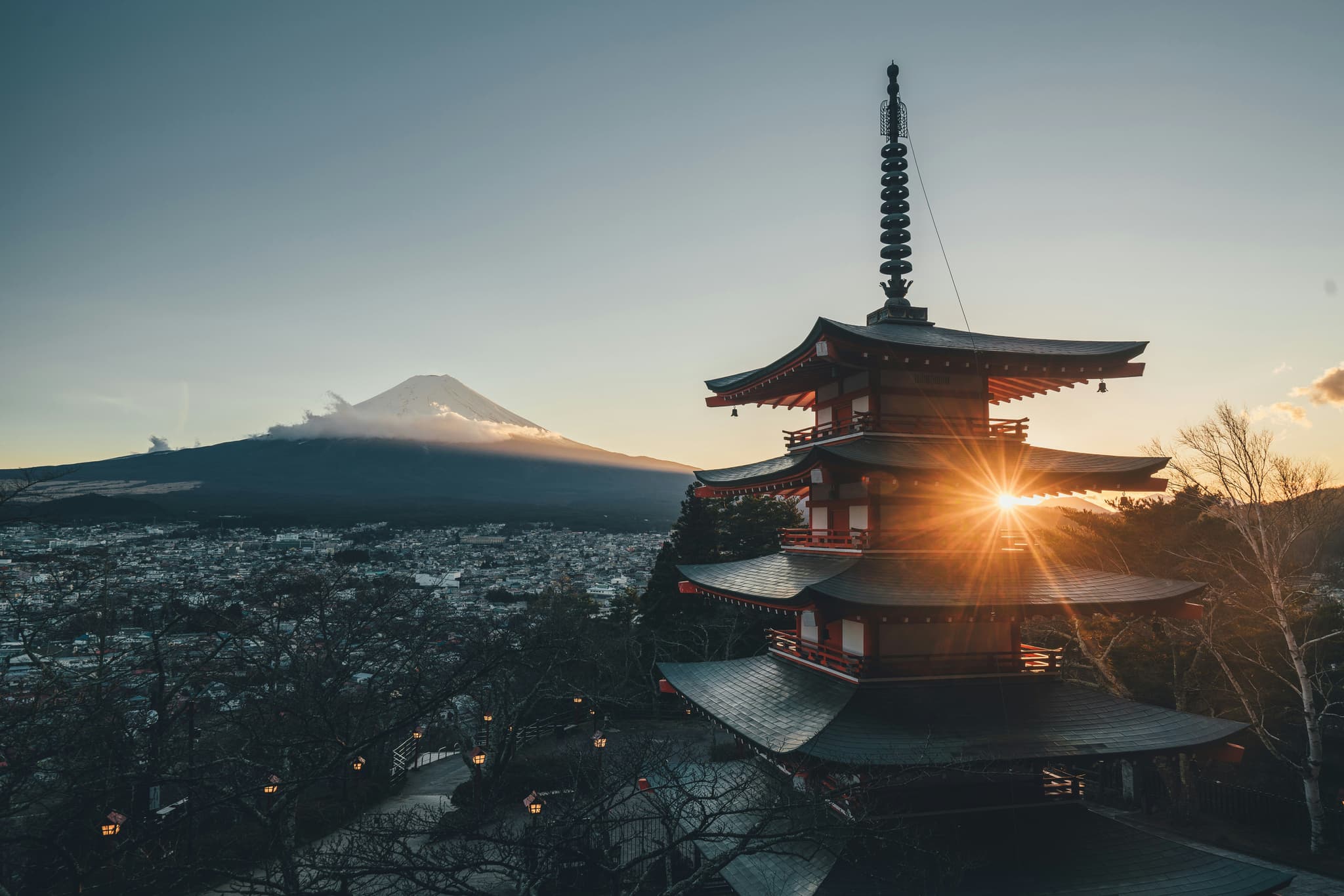Temple Japenese style red and city and mountain in the background during sunset in Tokyo