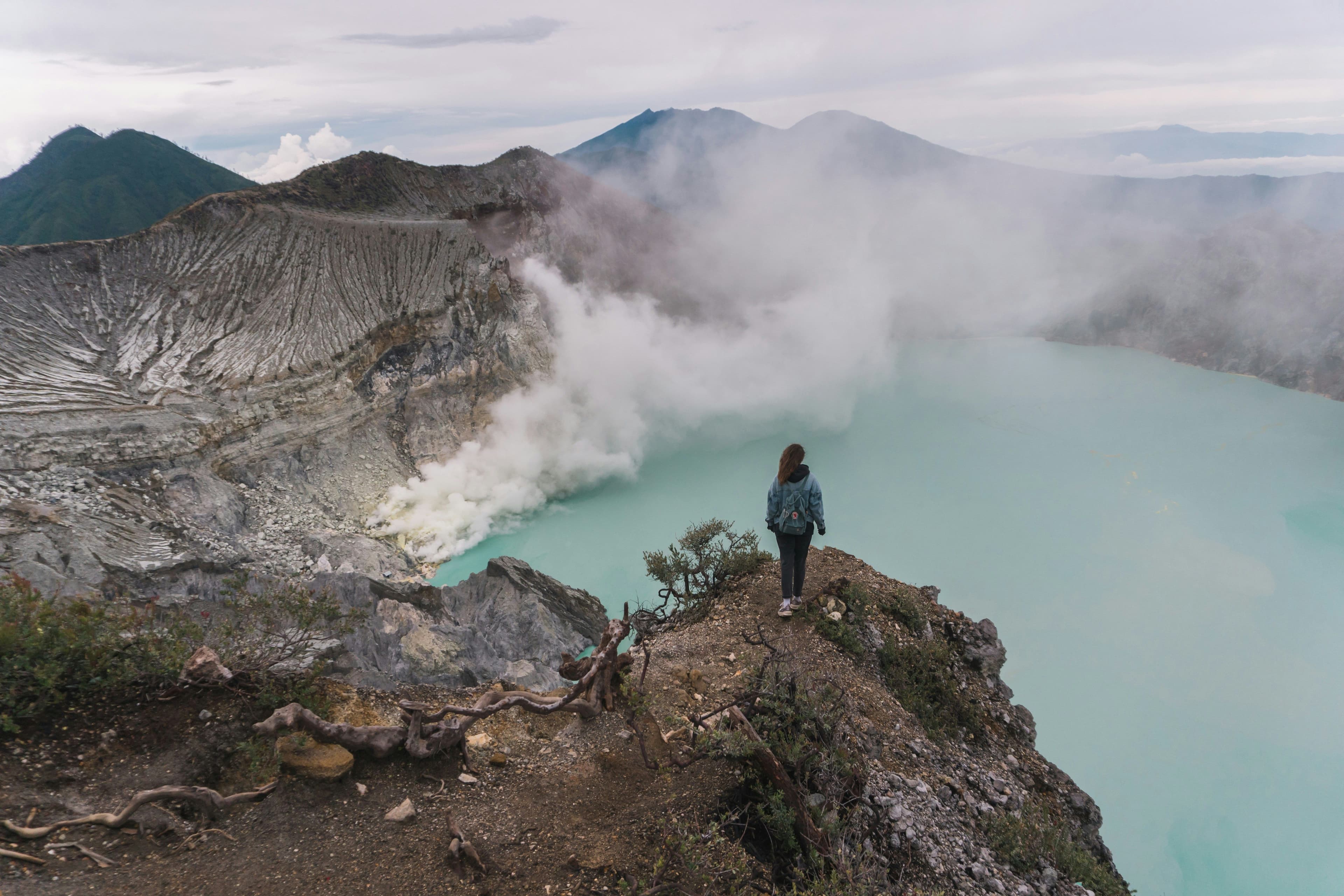 Ijen volcano with gas coming out, and a blue lake