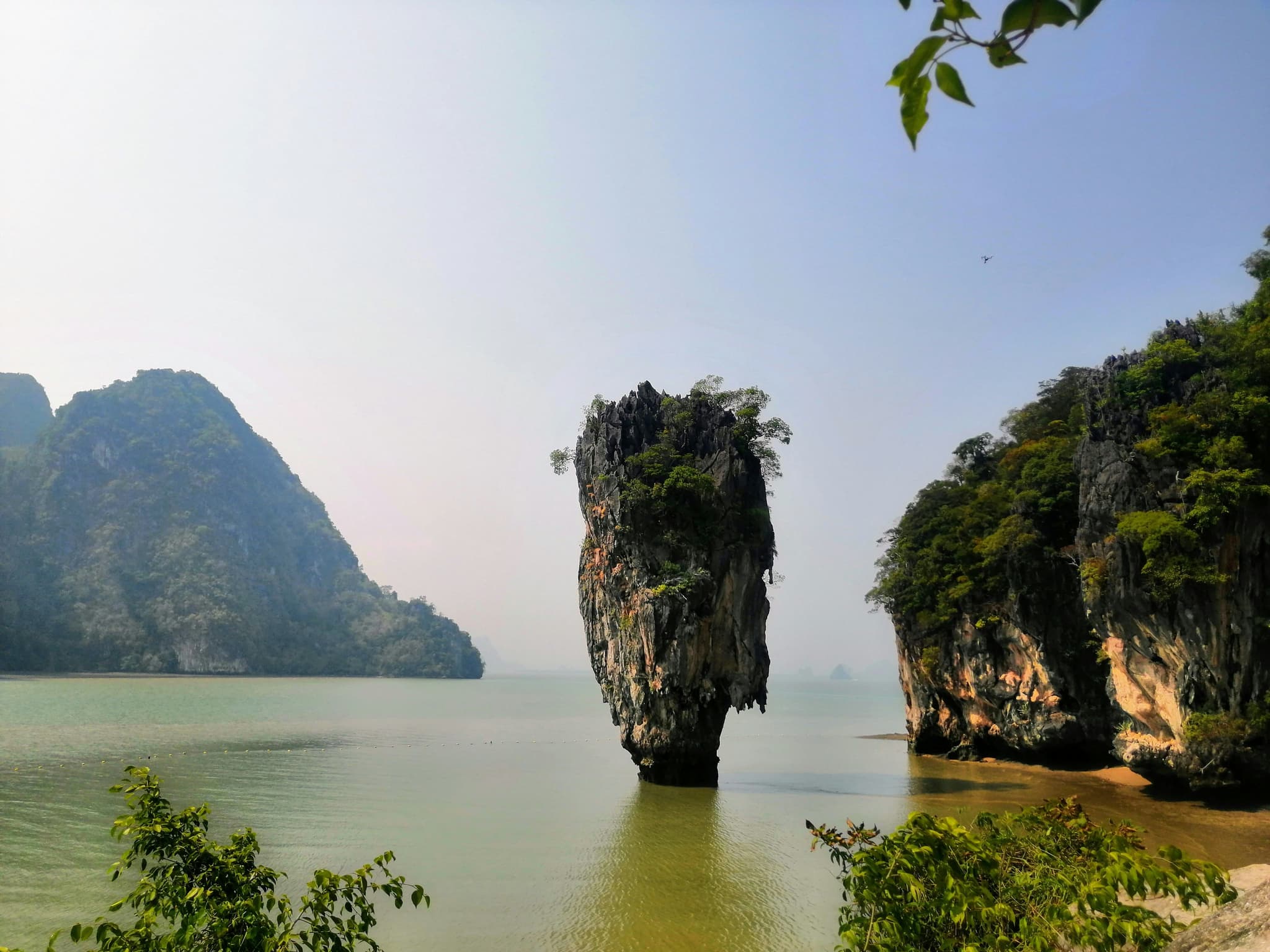 One limestone cliff in the middle of the water in Phang Nga Bay