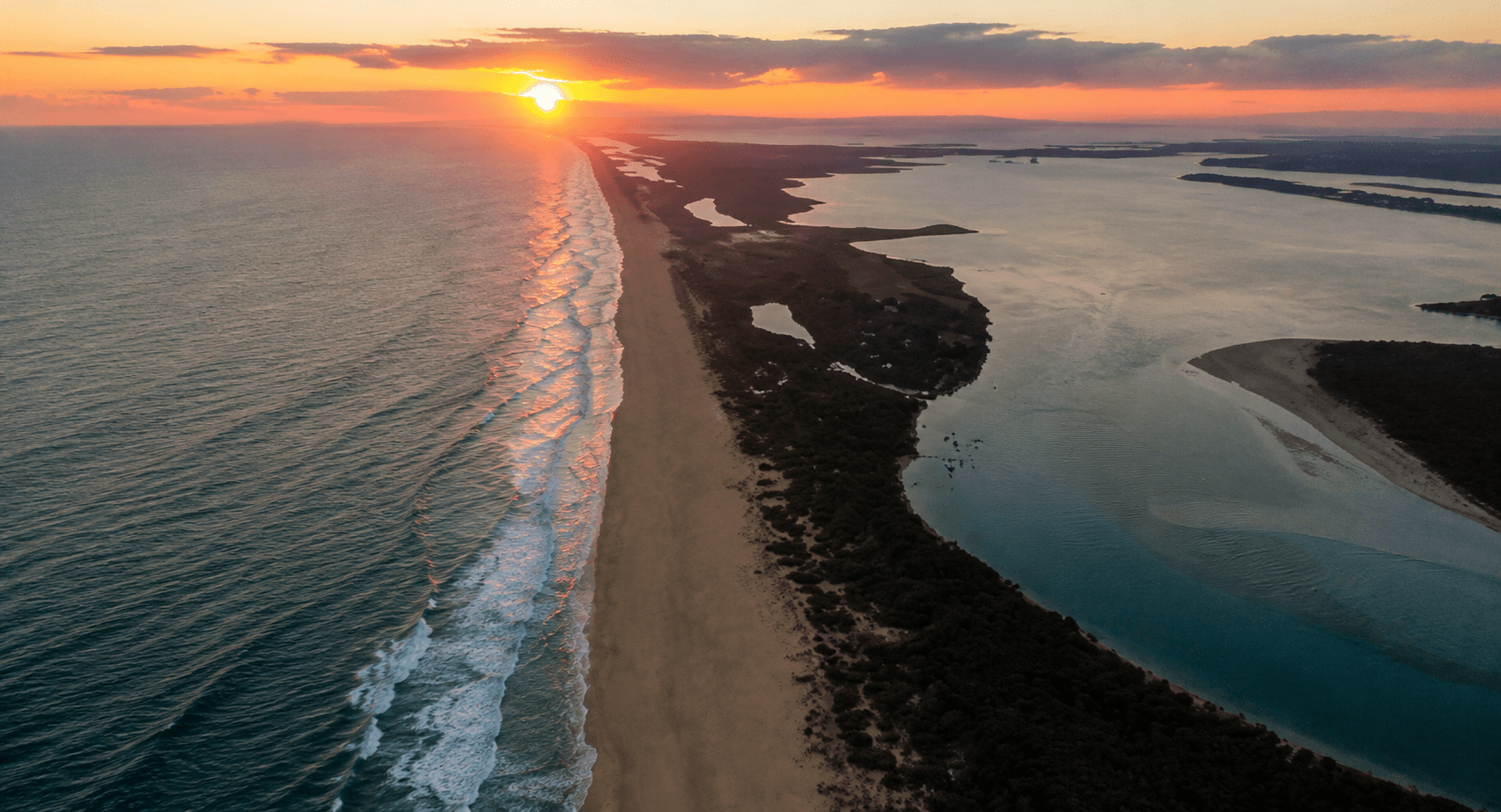 sunset at the beach, aerial view of the shore