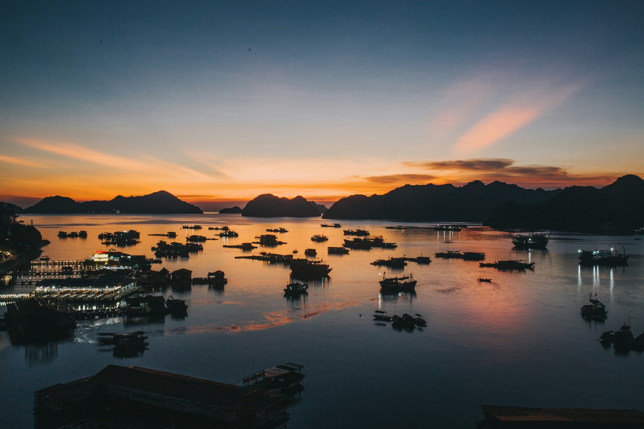 Sunset at halong bay Vietnam with orange reflection in the water