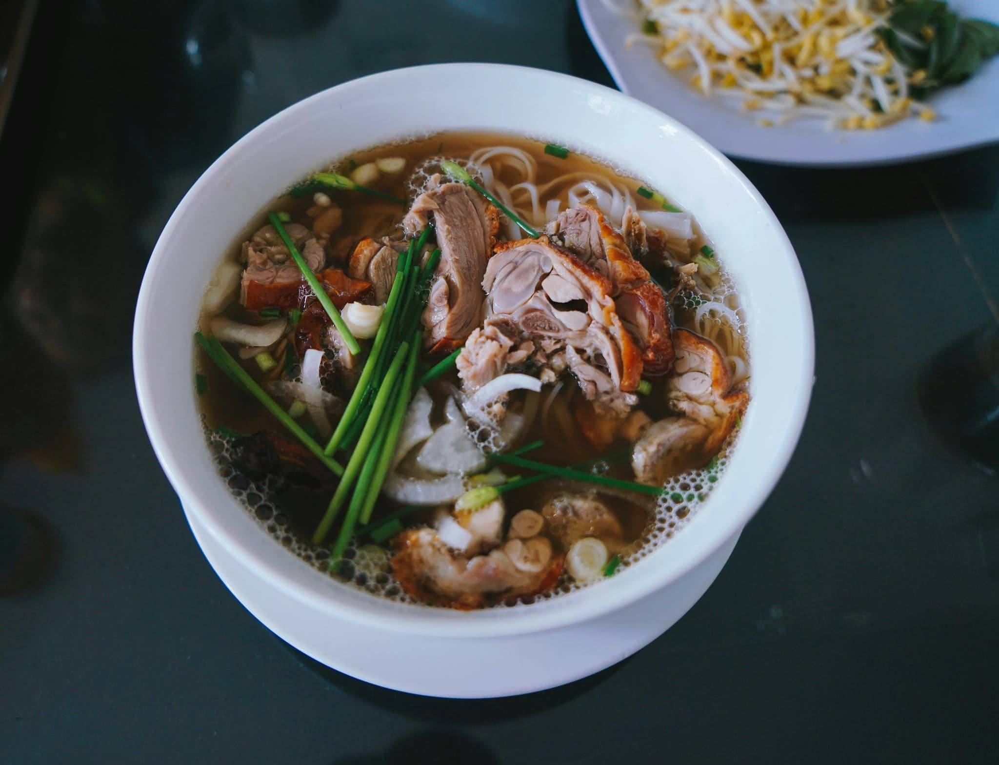 A bowl of Pho with beef from above