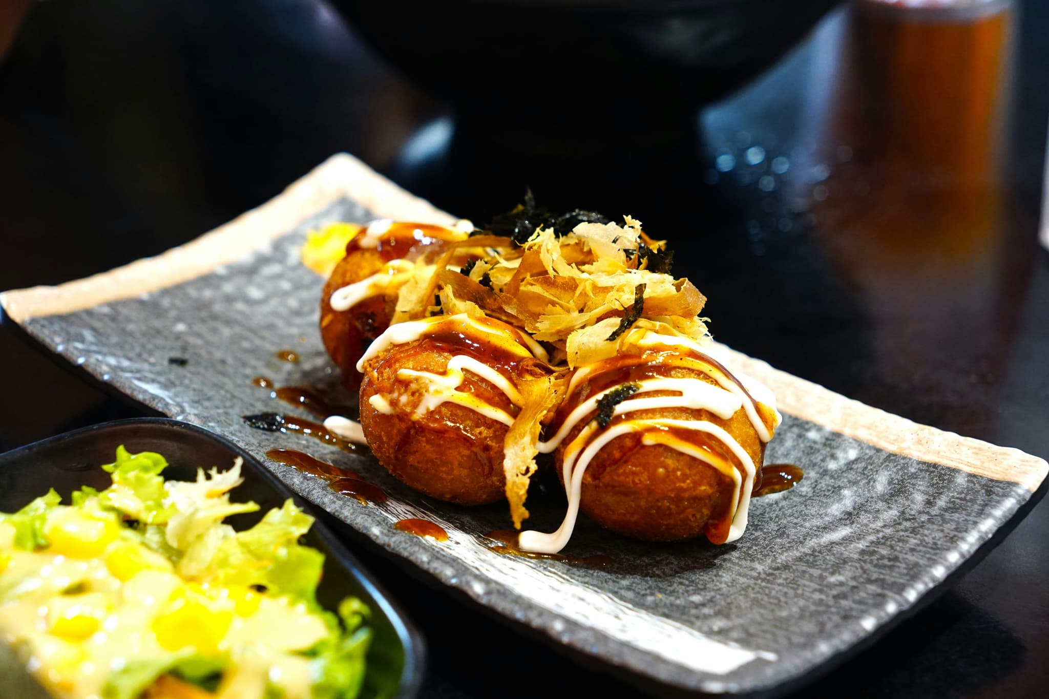 Takoyaki balls served on a plate