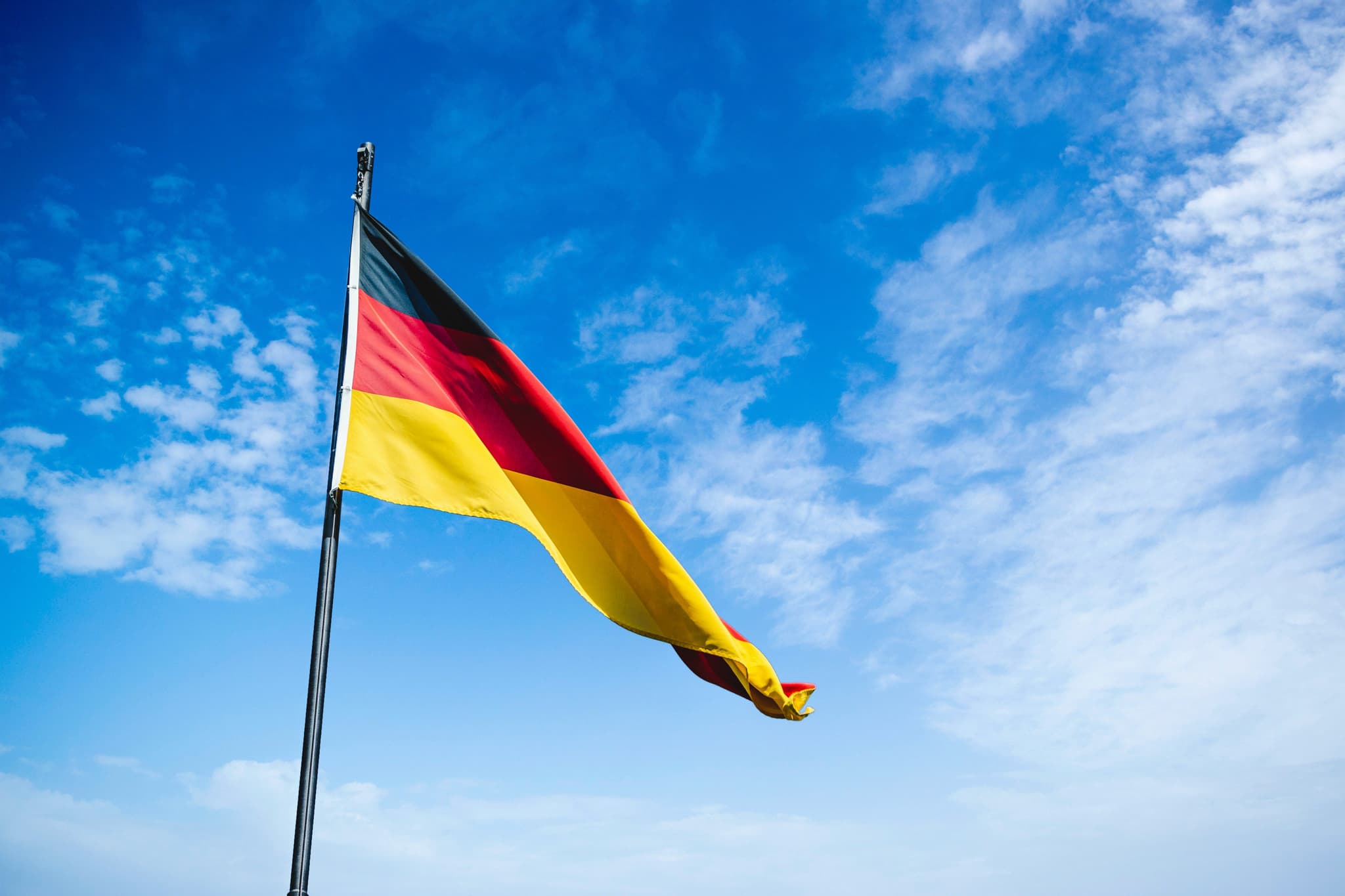 German flag and blue sky
