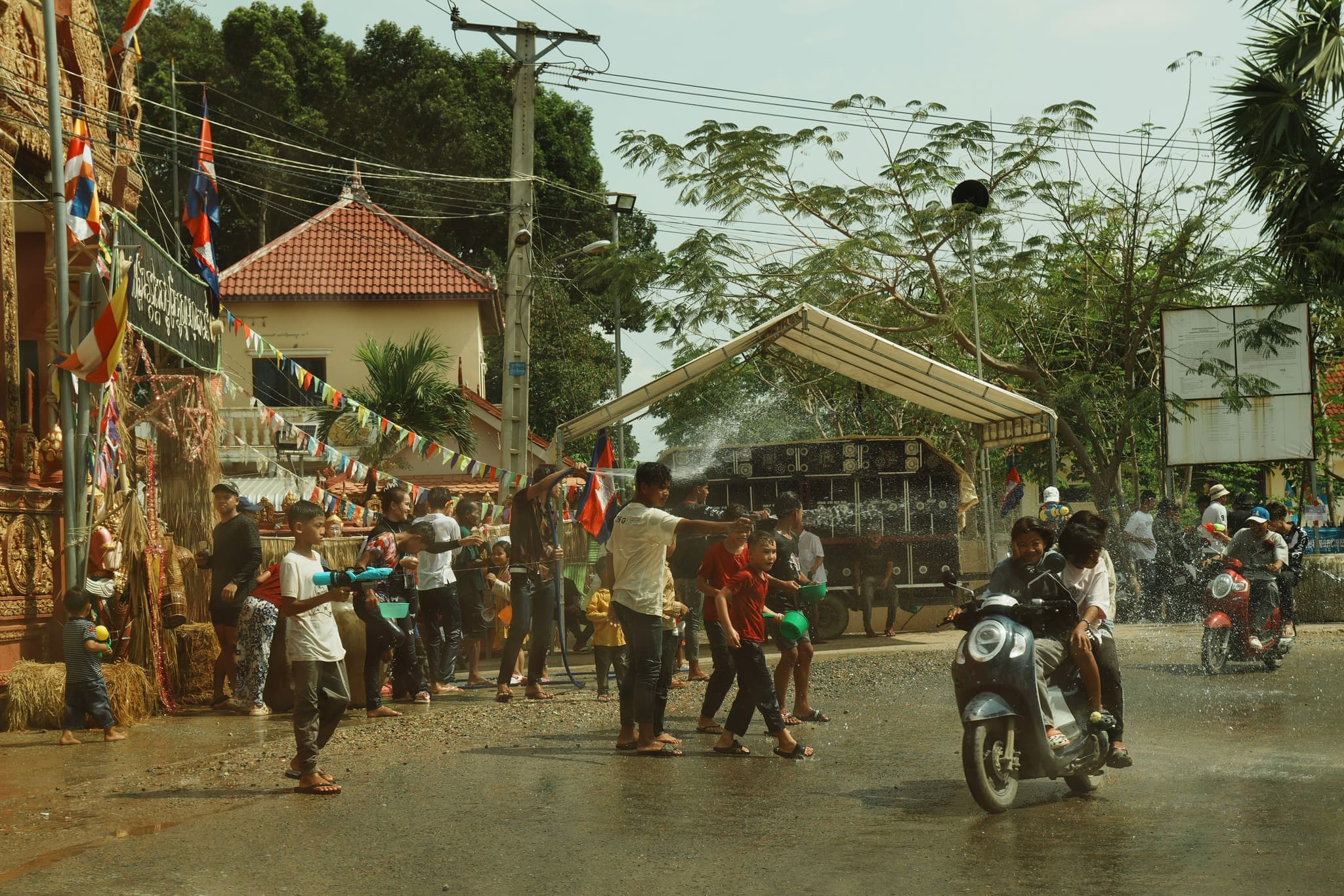 Thai local people playing with water in a waterfight for Songkran in April