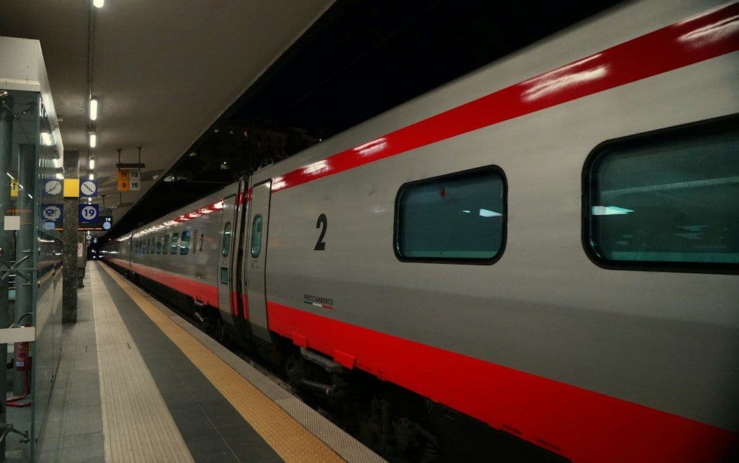 A modern train at a station platform in Italy