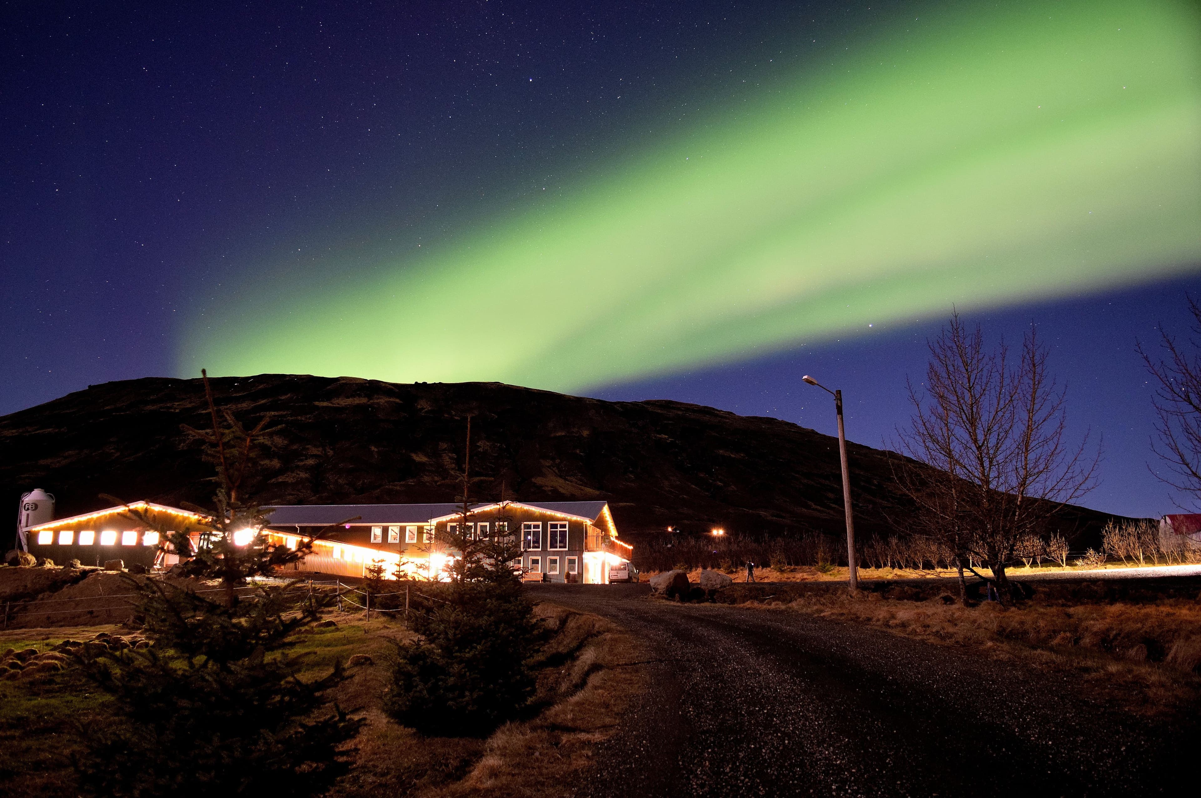 Northern lights reflected over hill in Iceland