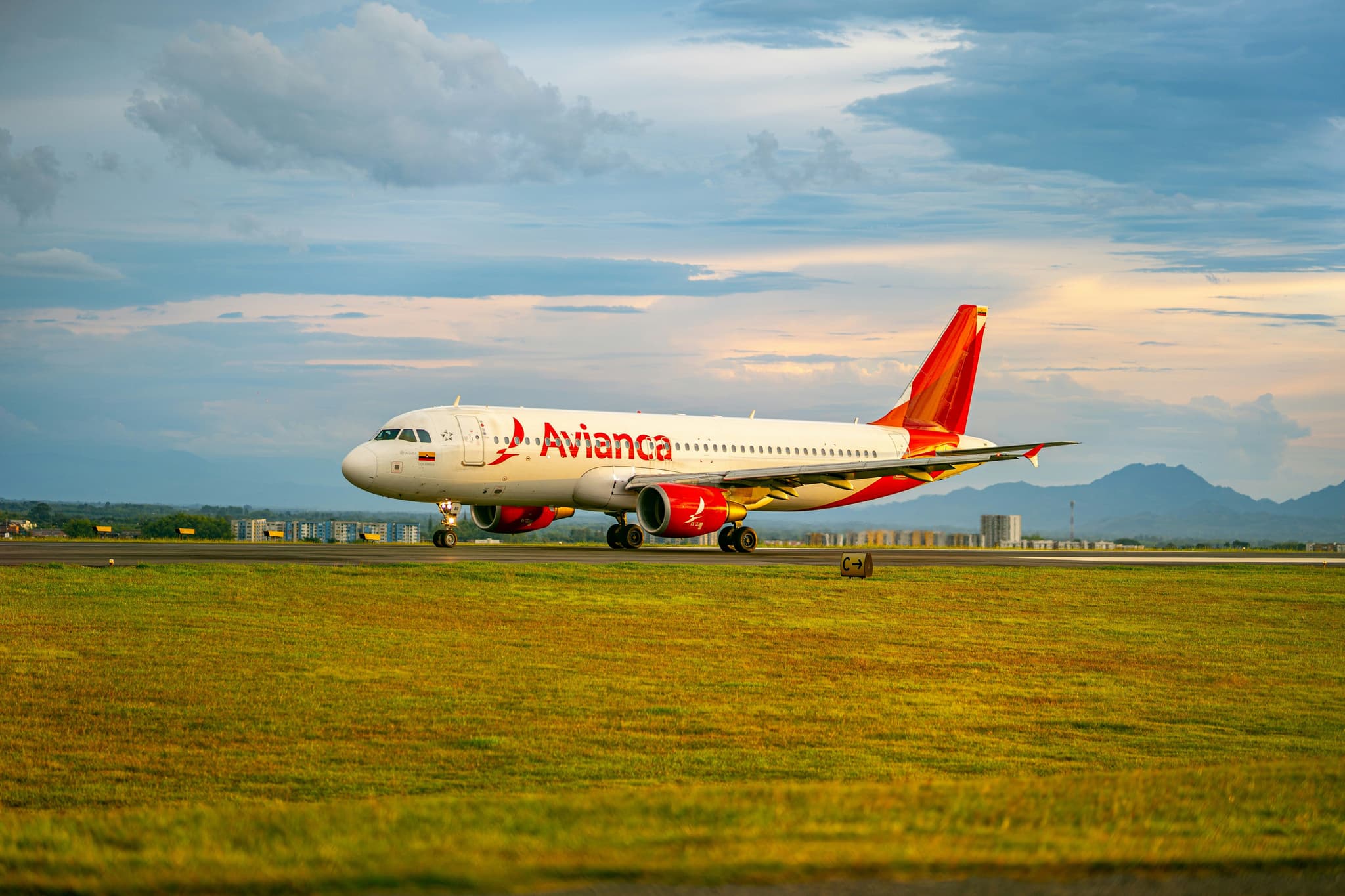 Avianca plane arriving on the grass at the airport