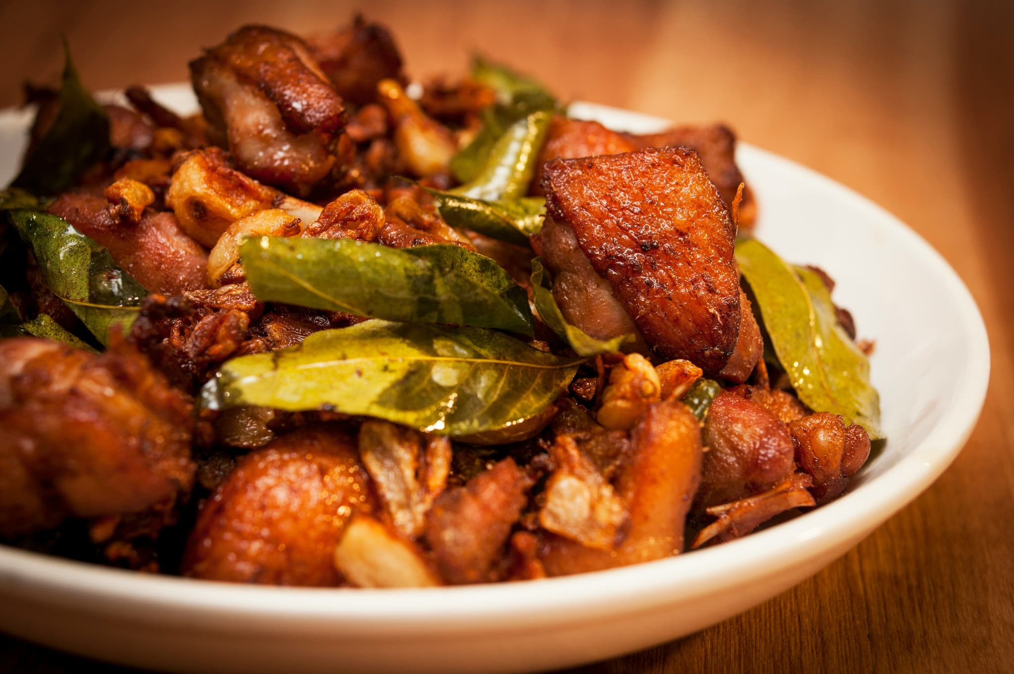 Filipino chicken adobo dish on a white plate