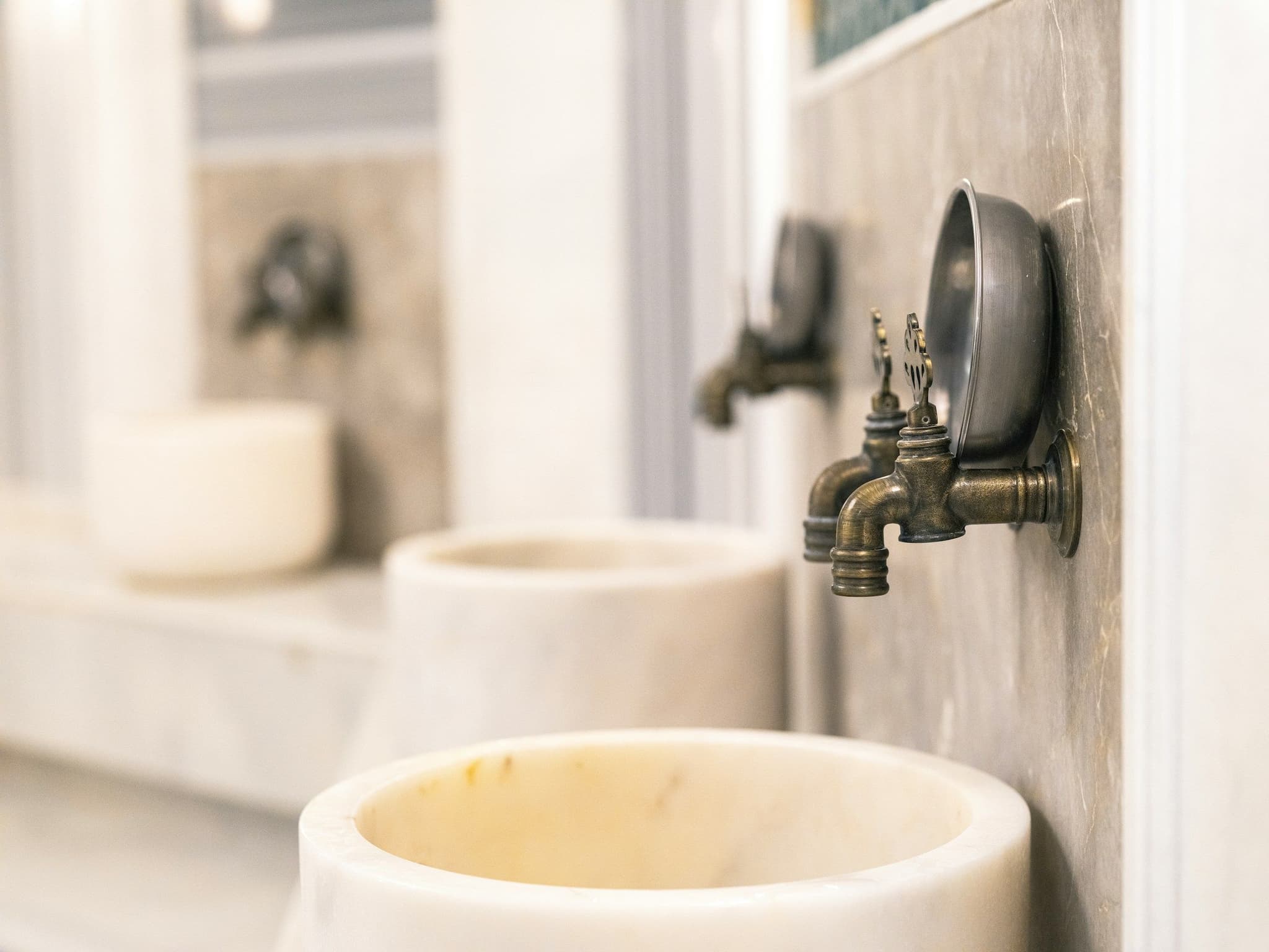 Marble basin and tap inside a traditional Turkish bath