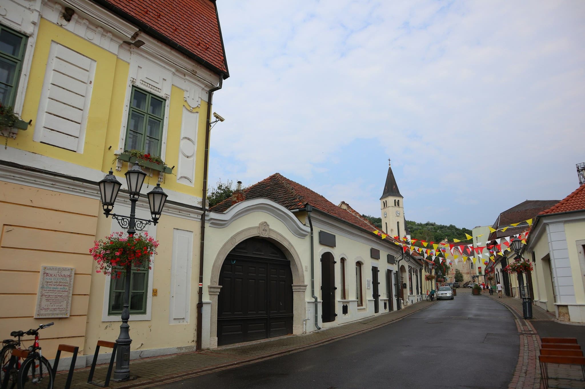 A street in Tokaj with a clock tower at the end